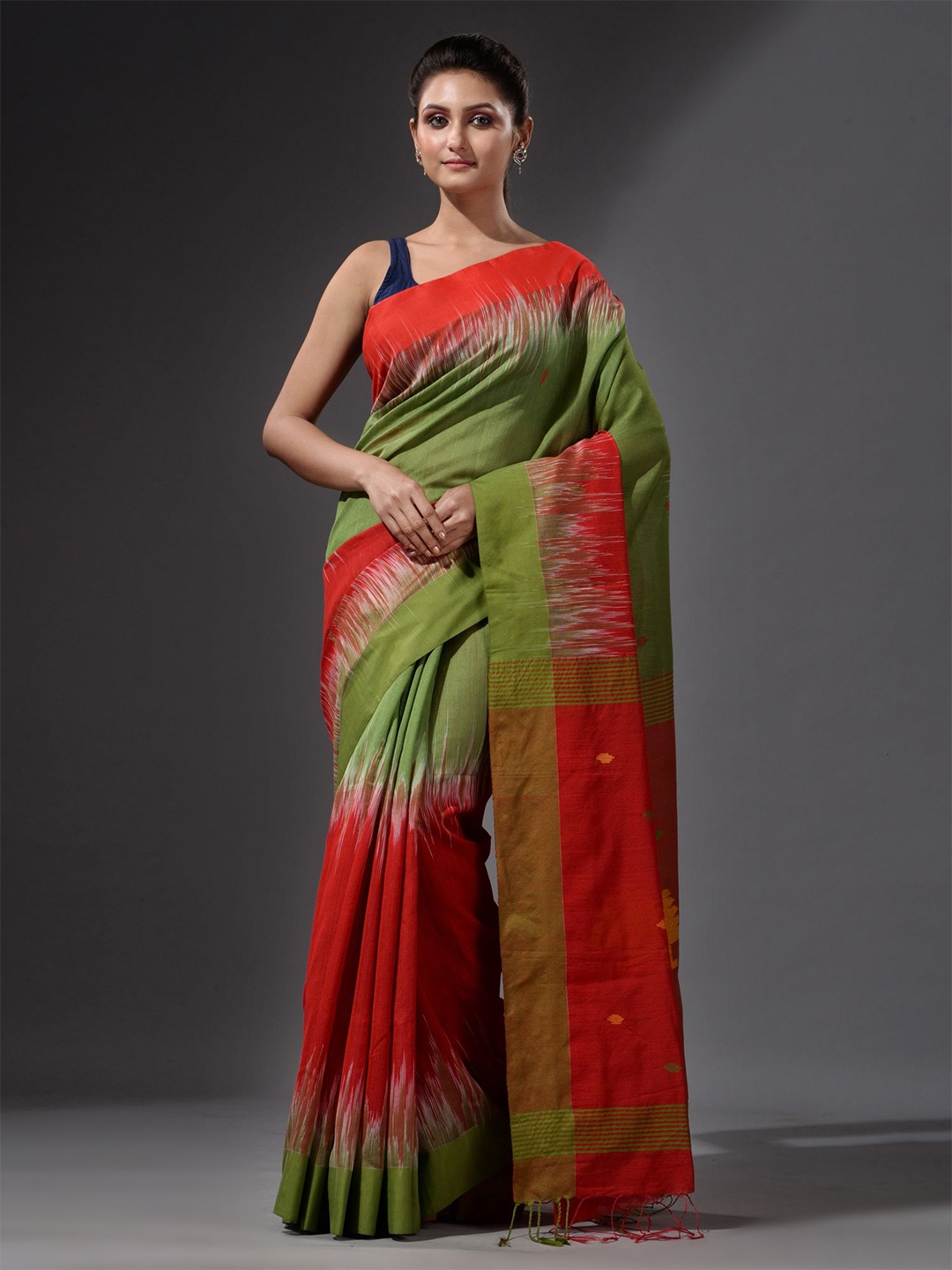 

Charukriti Green & Orange Woven Design Saree