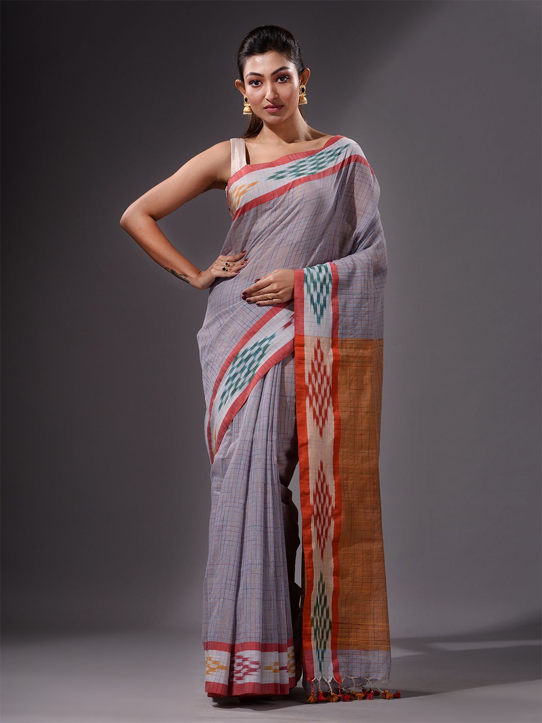 

Charukriti Mauve & Orange Checked Saree