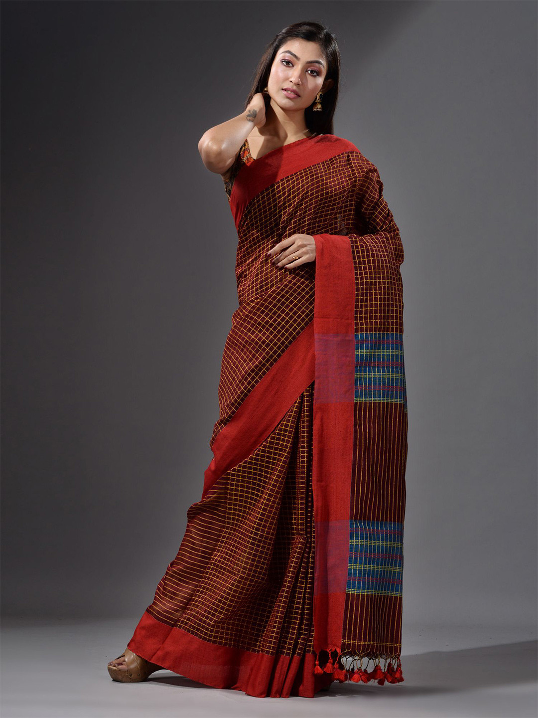 

Charukriti Red & Blue Checked Cotton Blend Saree