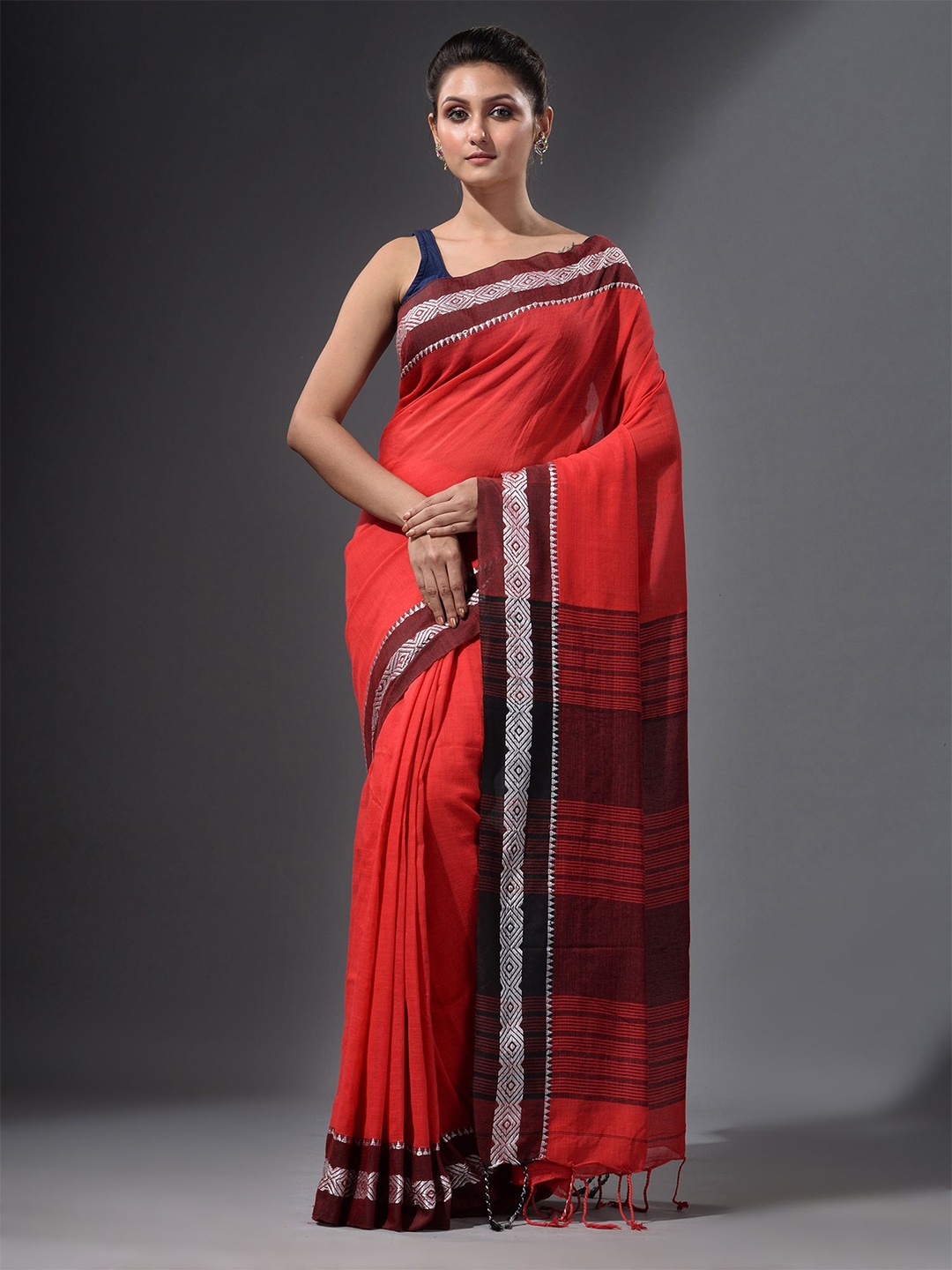 

Charukriti Orange & Silver-Toned Ethnic Motifs Pure Cotton Saree