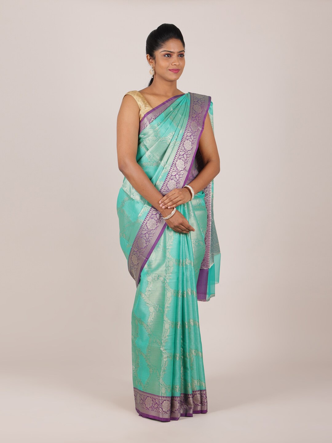 

Pothys Green & Purple Ethnic Motifs Woven Silk Cotton Zari Saree