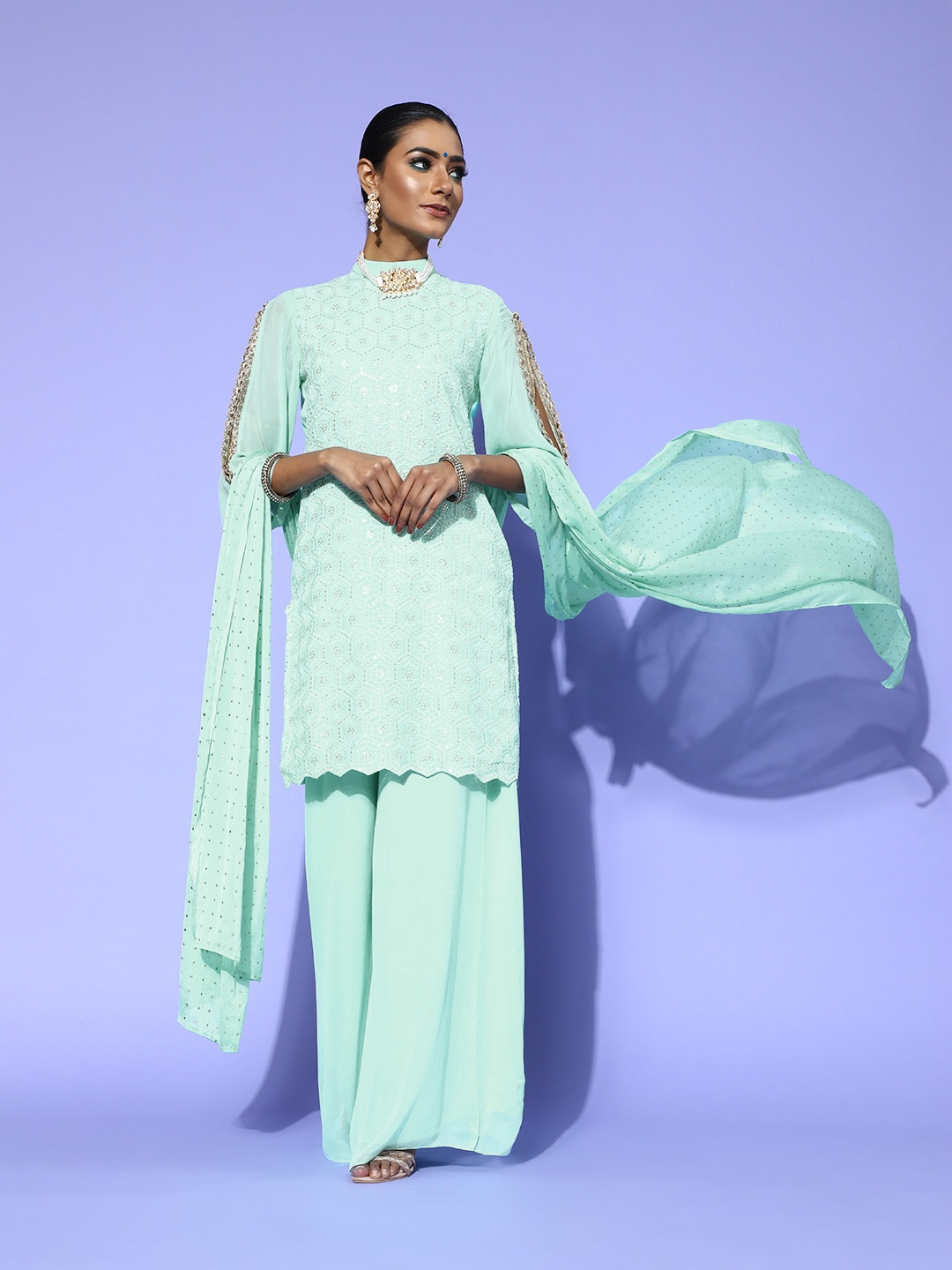 

Saadgi Alluring Turquoise Blue Silk Georgette Scalloped Edge Dress Material