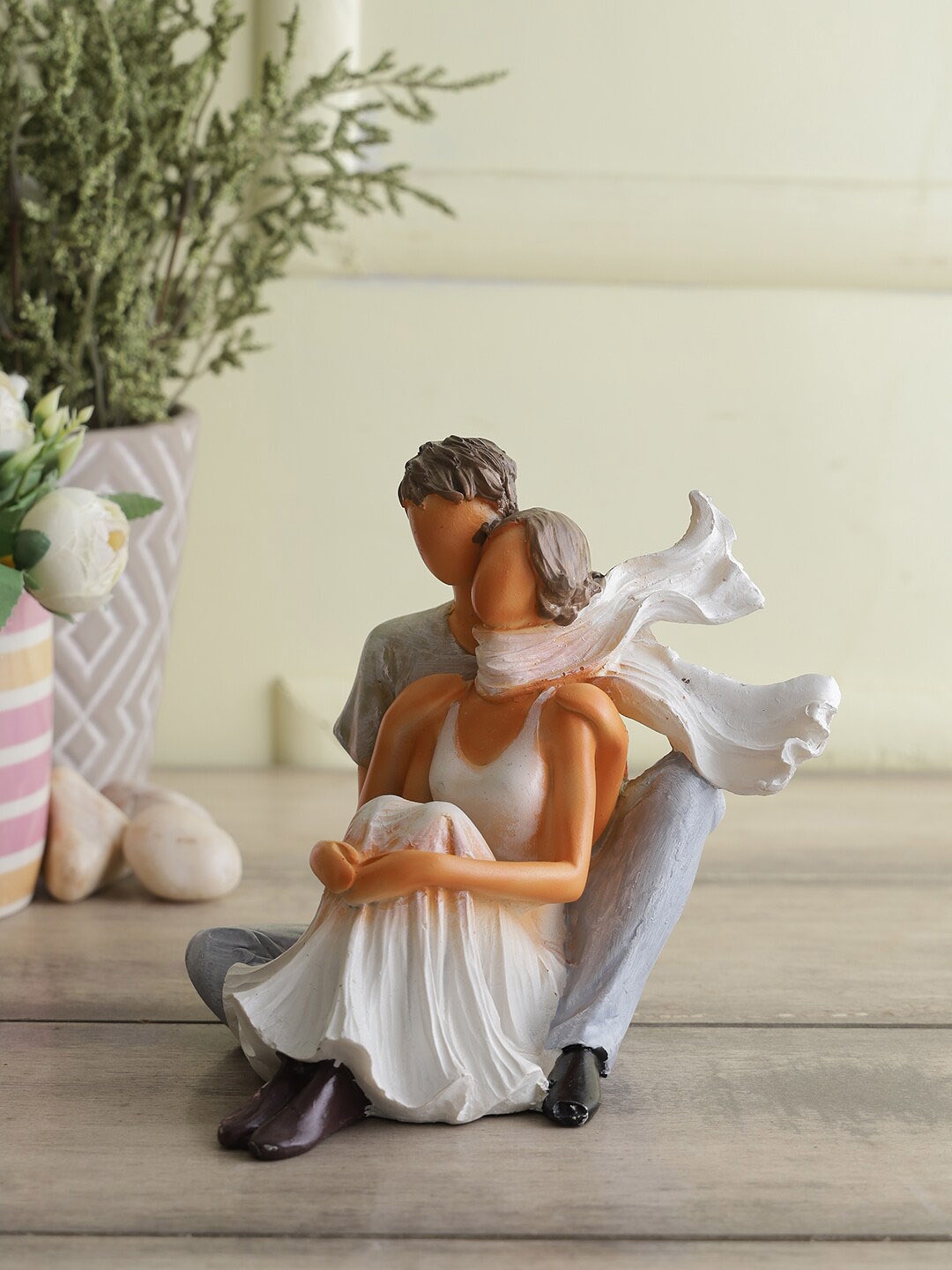 

CraftVatika White & Grey Polyresin Sitting Love Couple Statue Showpiece