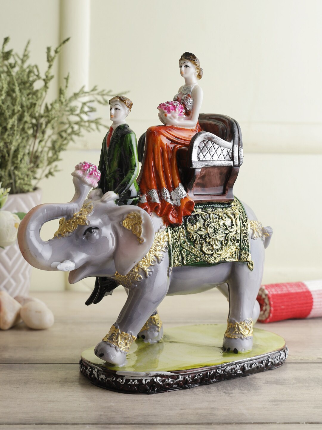 

CraftVatika Grey & Green Solid Love Couple Sitting On Elephant Polyresin Showpiece