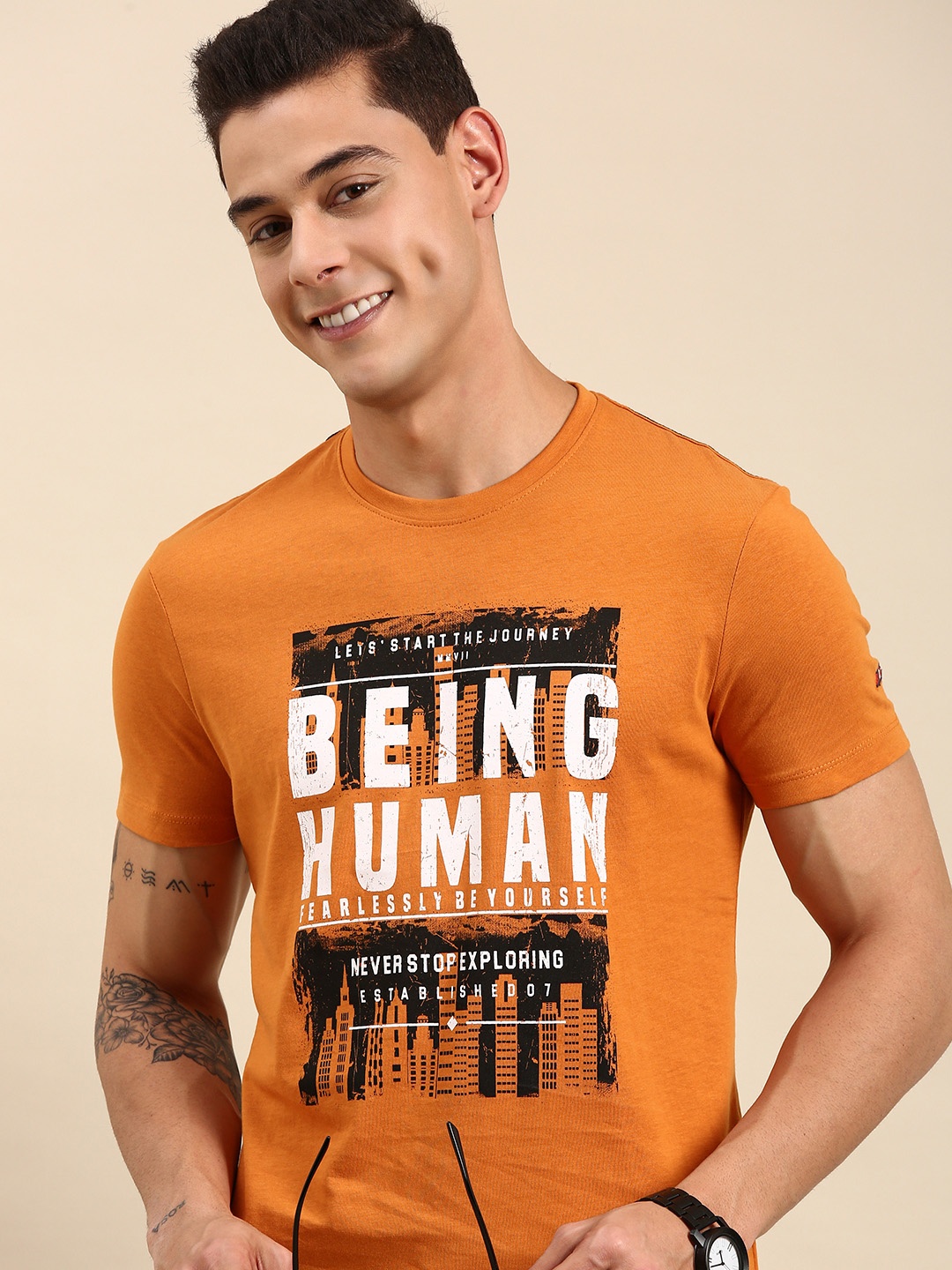 

Being Human Men Orange & Black Typography Printed Casual T-shirt