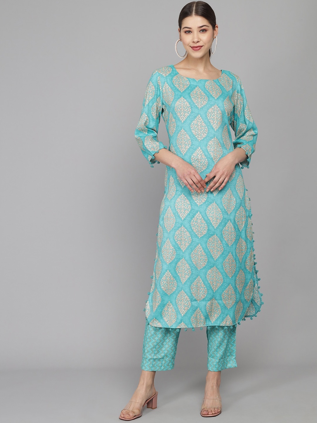 

Prakhya Women Turquoise Blue & Beige Ethnic Motifs Printed Kurta with Trousers