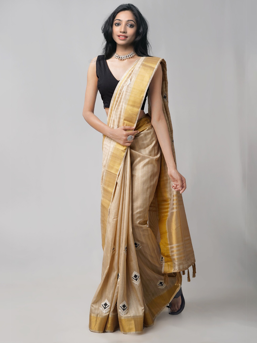 

Unnati Silks Taupe & Black Ethnic Motifs Zari Silk Blend Tussar Saree