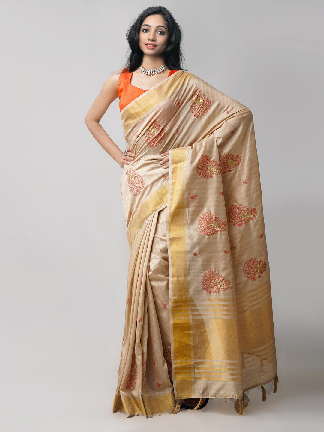 

Unnati Silks Beige & Red Ethnic Motifs Embroidered Silk Blend Tussar Saree
