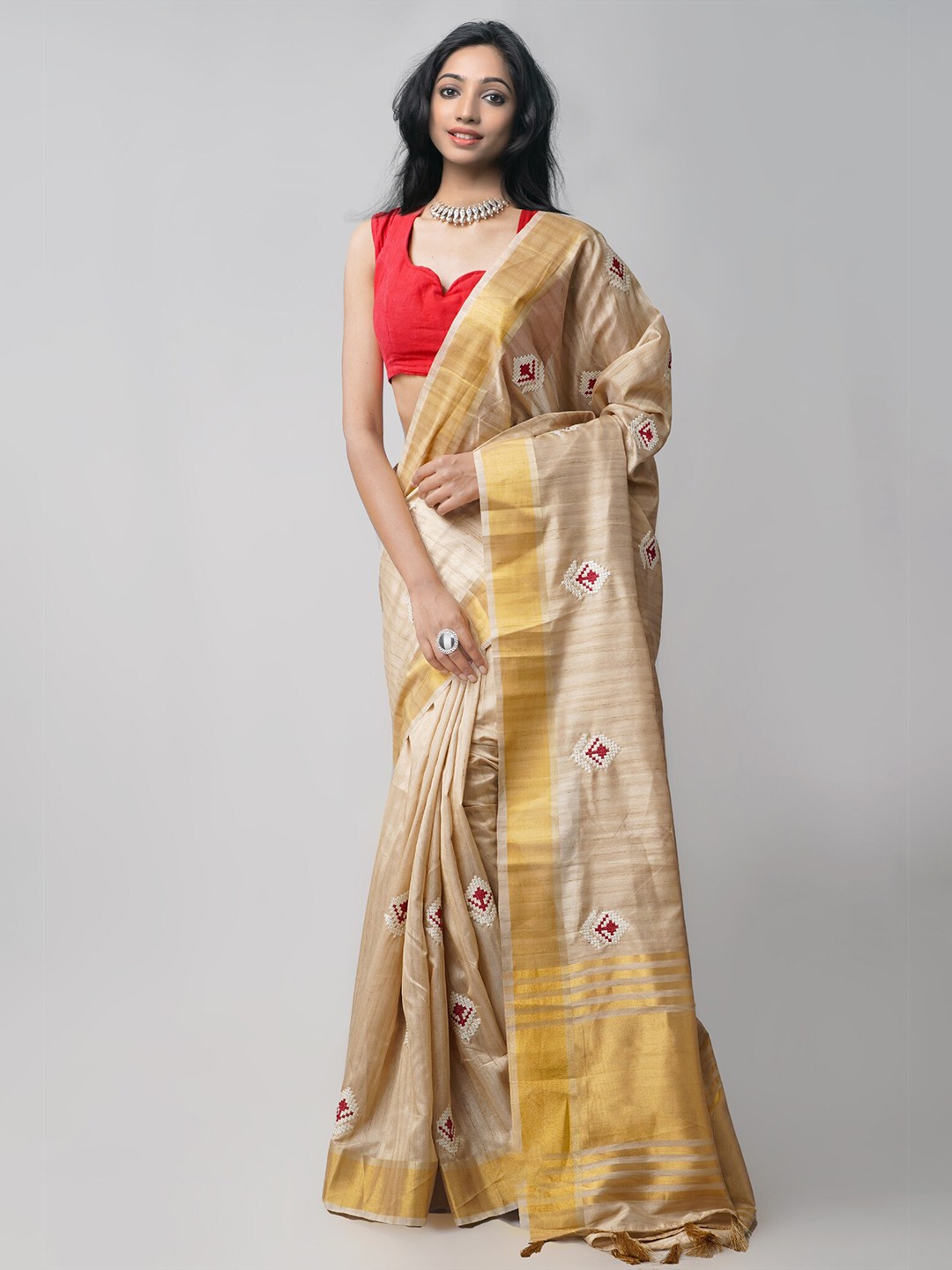 

Unnati Silks Brown & White Floral Zari Silk Blend Tussar Saree