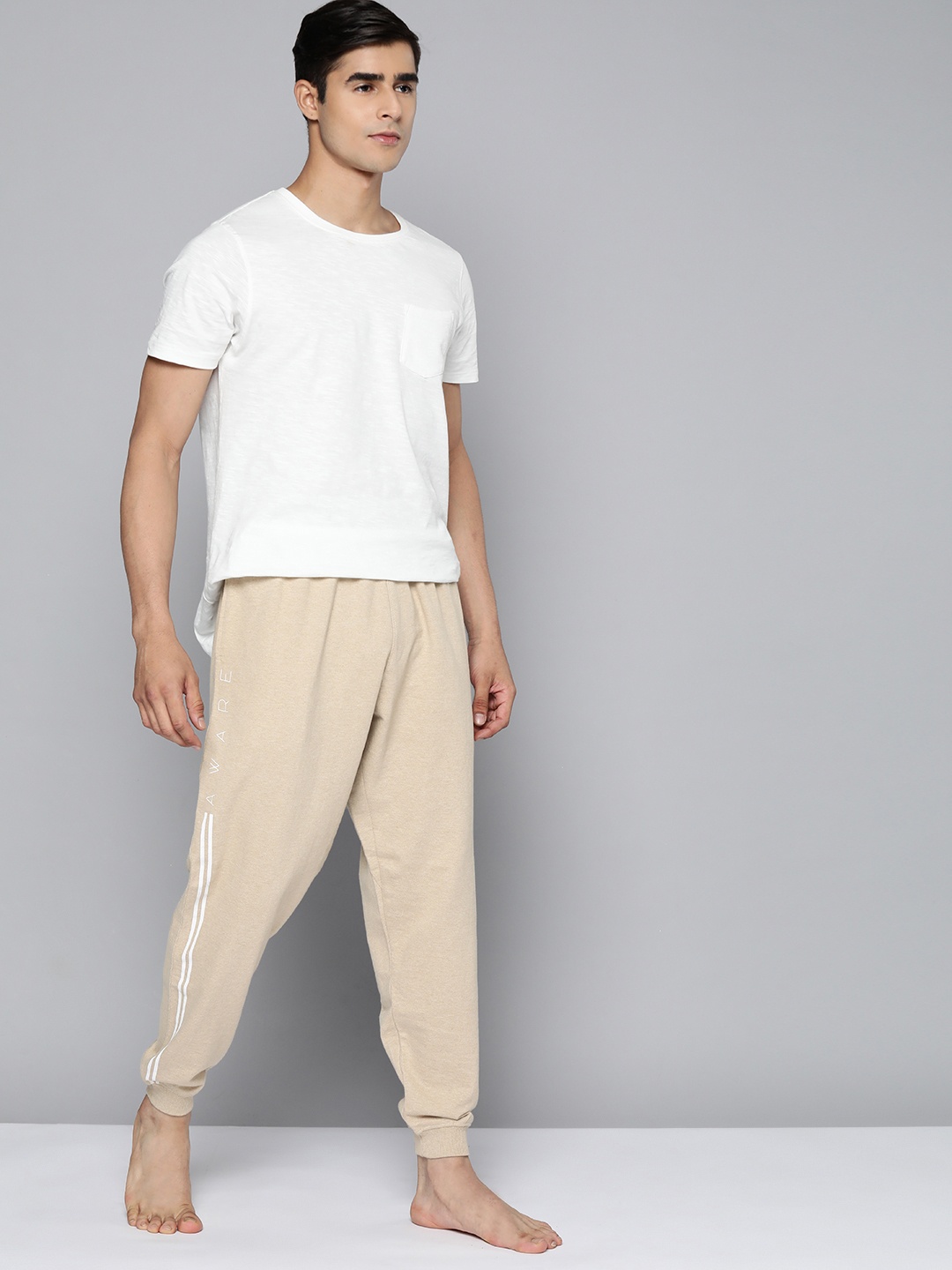 

HRX By Hrithik Roshan Yoga Men Myrrobolan Mel Cotton Typography Track Pants, Beige