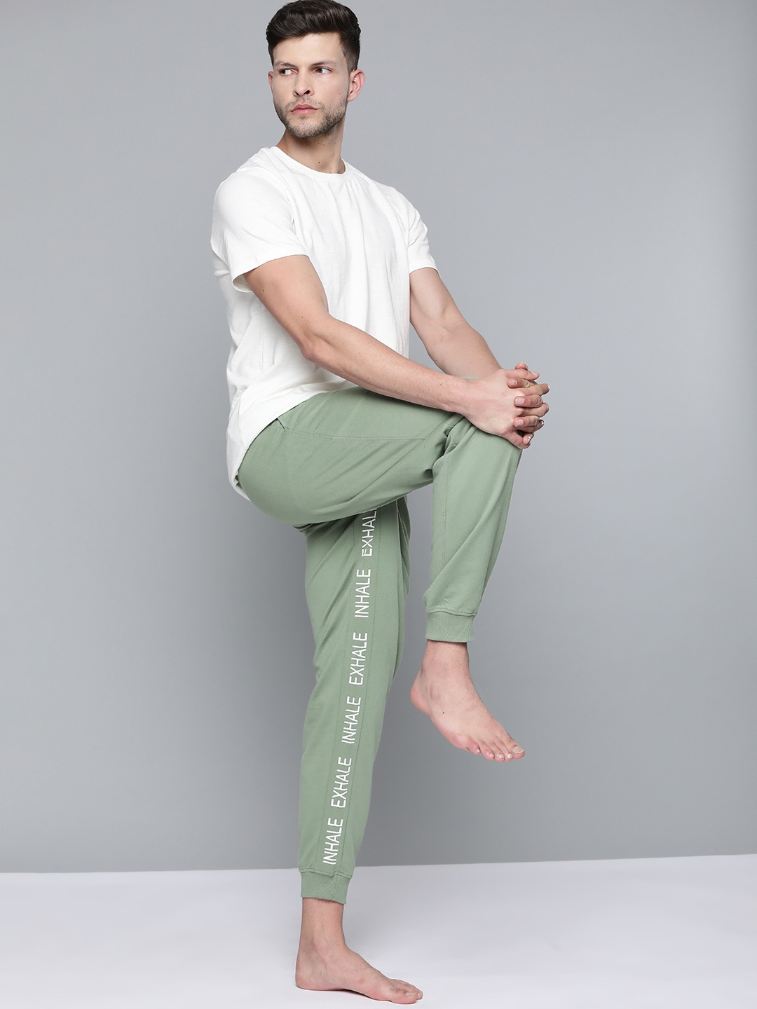 

HRX By Hrithik Roshan Yoga Men Jade Organic Cotton Typography Track Pants, Olive