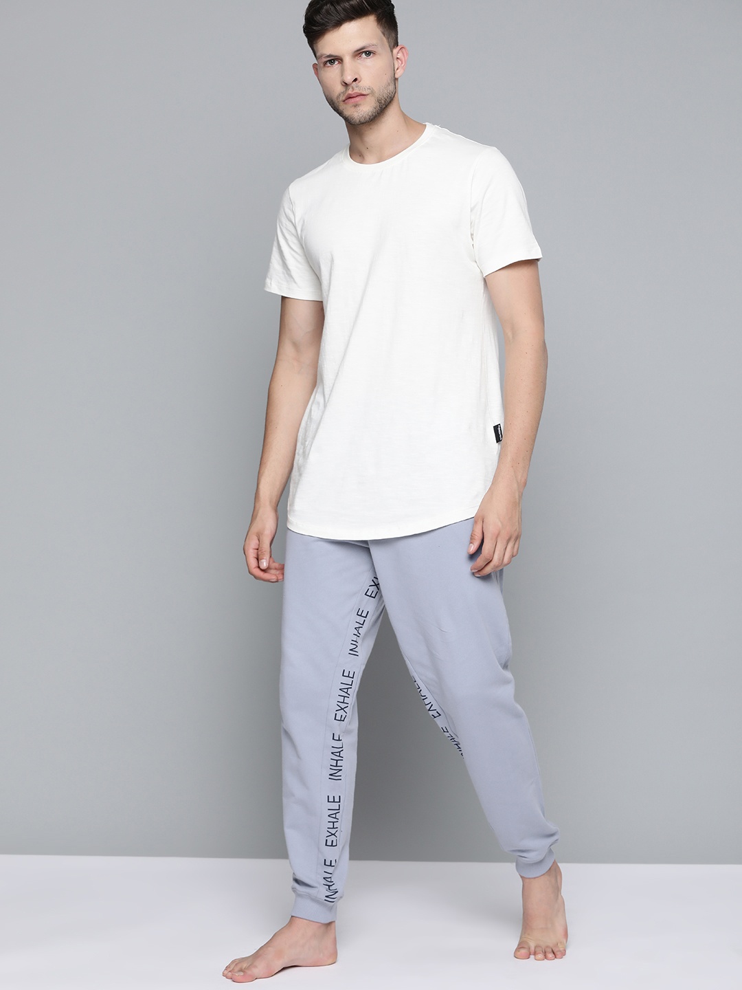 

HRX By Hrithik Roshan Yoga Men Aleutian Organic Cotton Typography Track Pants, Blue