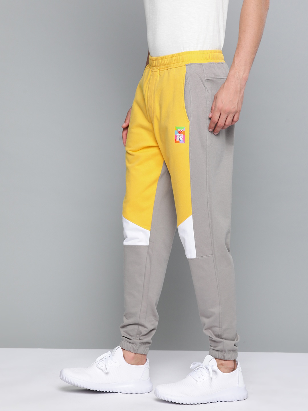 

HRX By Hrithik Roshan Lifestyle Men Aspen Gold Bio-Wash Colourblock Track Pants, Yellow
