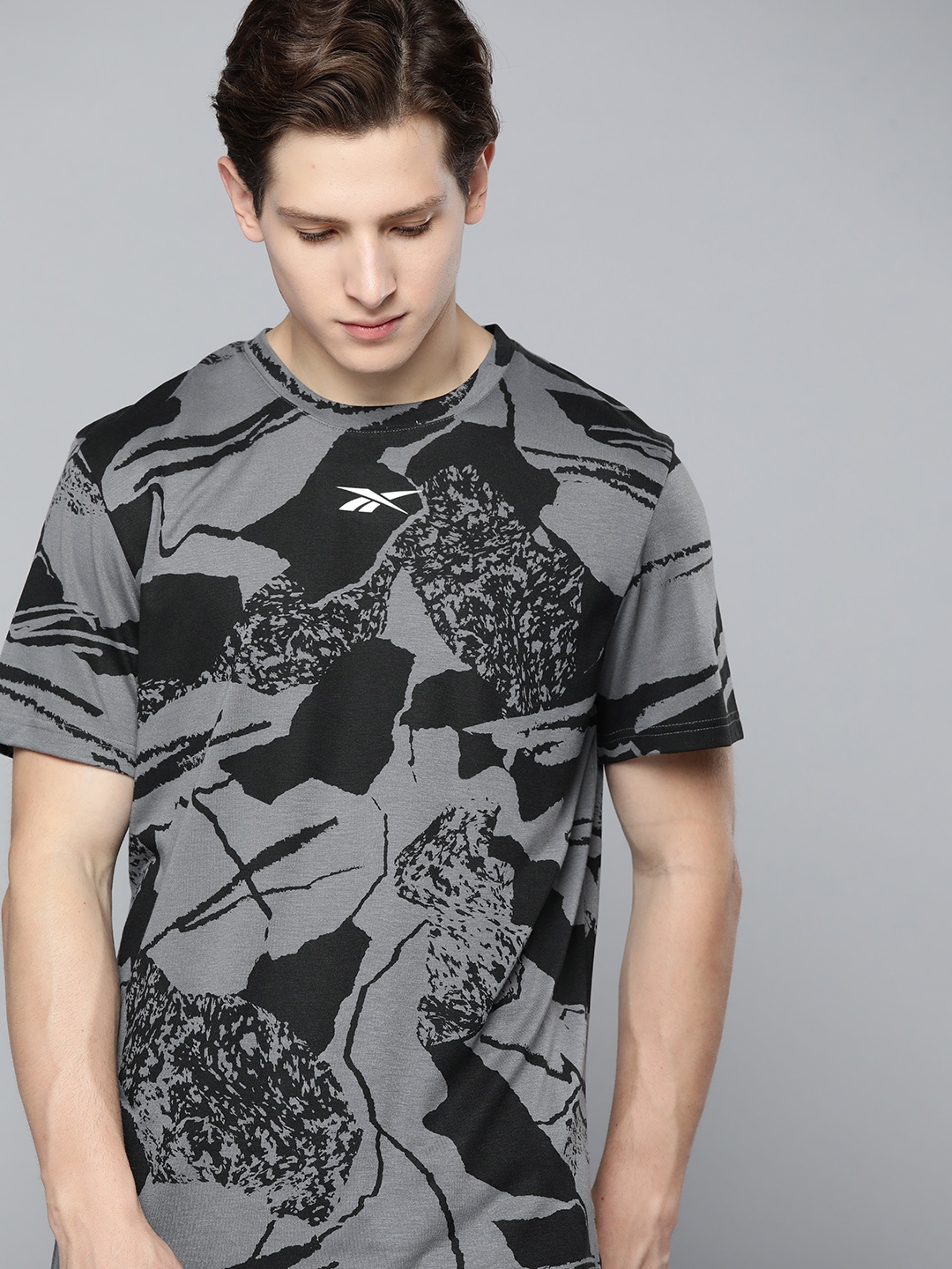 

Reebok Men Black & Grey Abstract Printed Training or Gym T-shirt