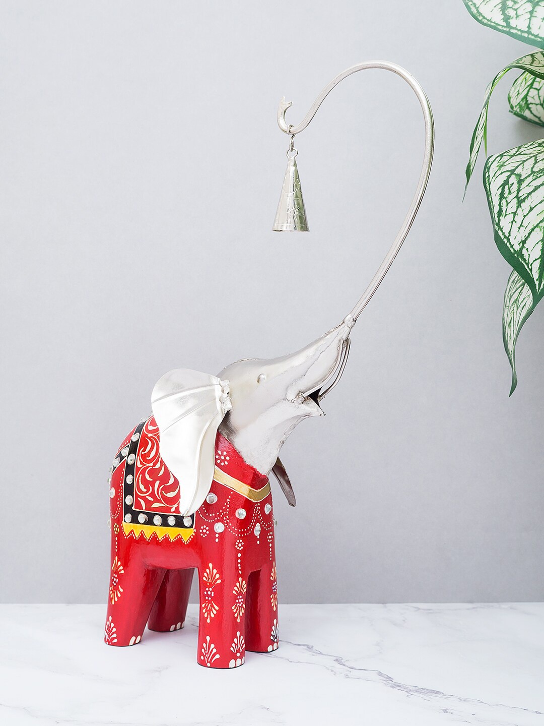 

Golden Peacock Red & Silver-Toned Wooden Elephant With Bell Showpiece