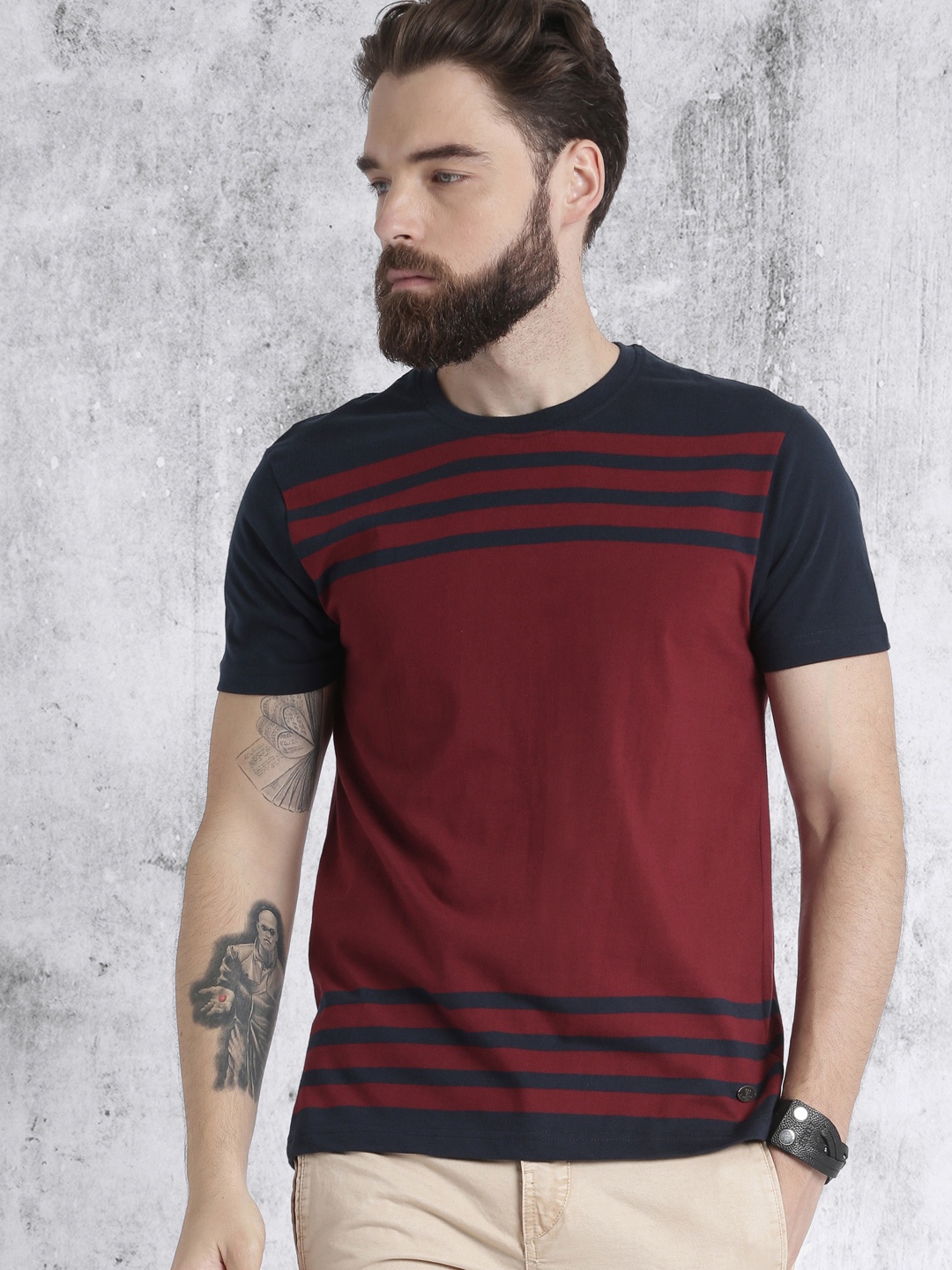 

Roadster Men Maroon & Navy Striped Round Neck T-shirt