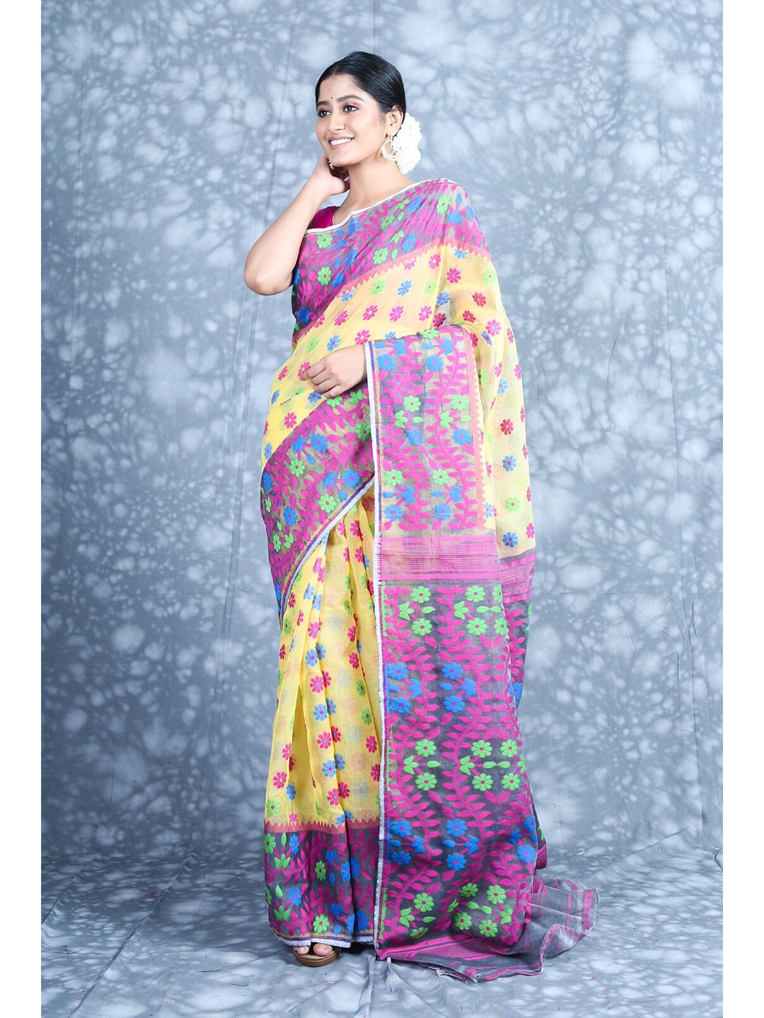 

Charukriti Yellow & Magenta Floral Silk Cotton Jamdani Saree