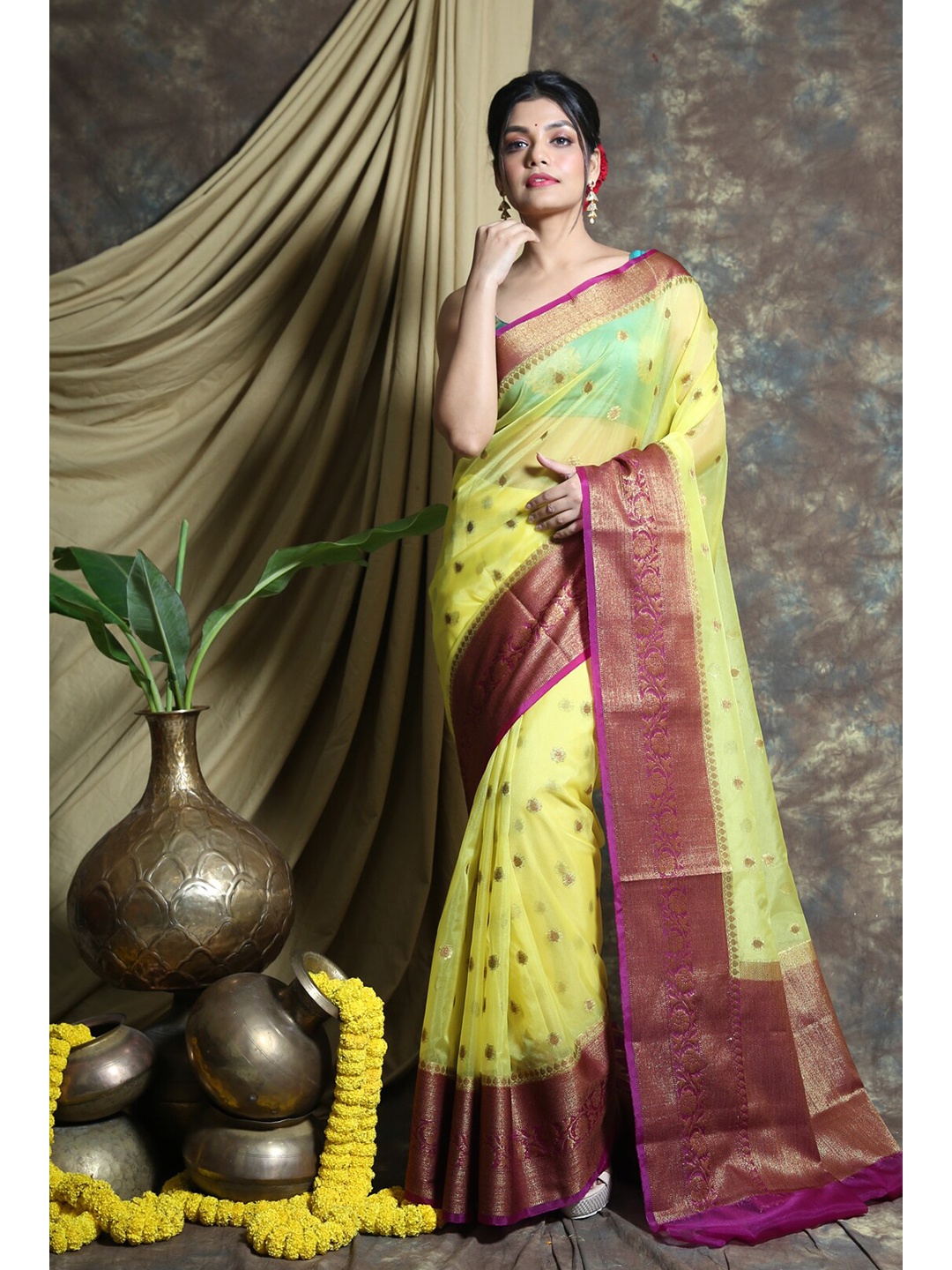 

Charukriti Yellow & Purple Woven Design Organza Saree