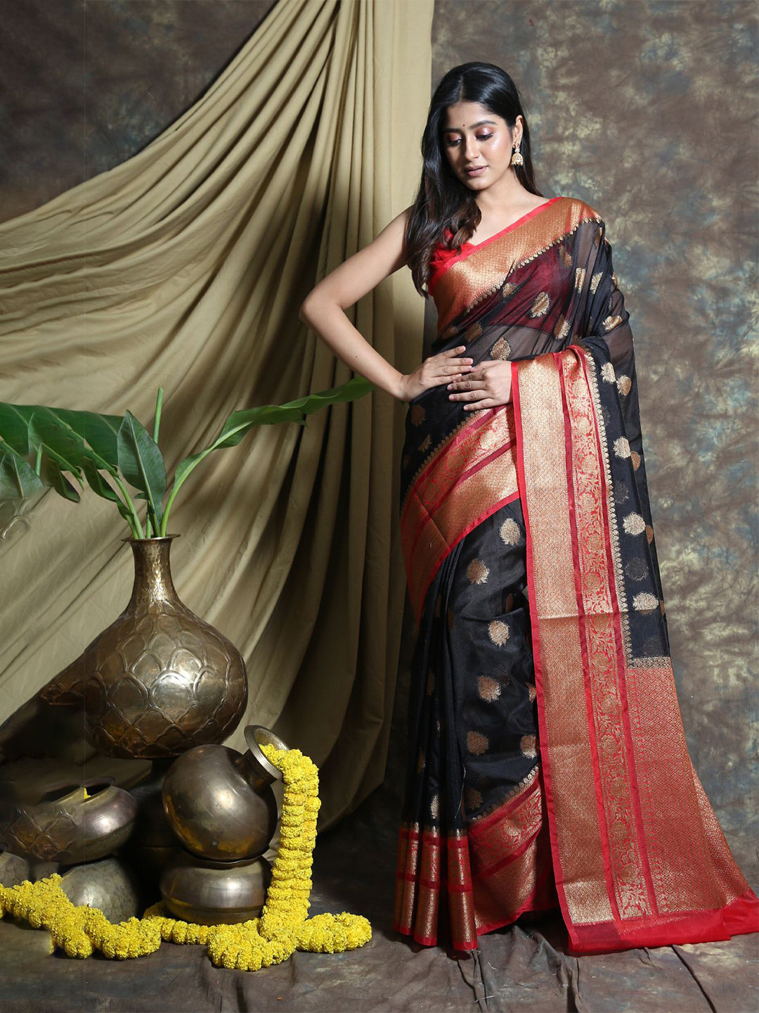 

Charukriti Black & Red Ethnic Motifs Zari Organza Saree
