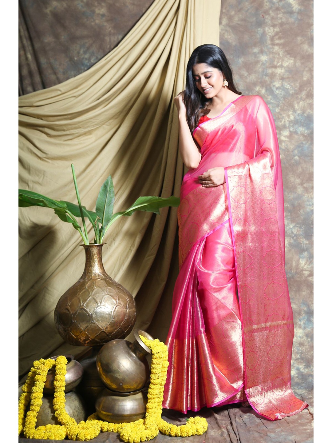 

Charukriti Pink & Gold-Toned Woven Design Zari Tissue Saree