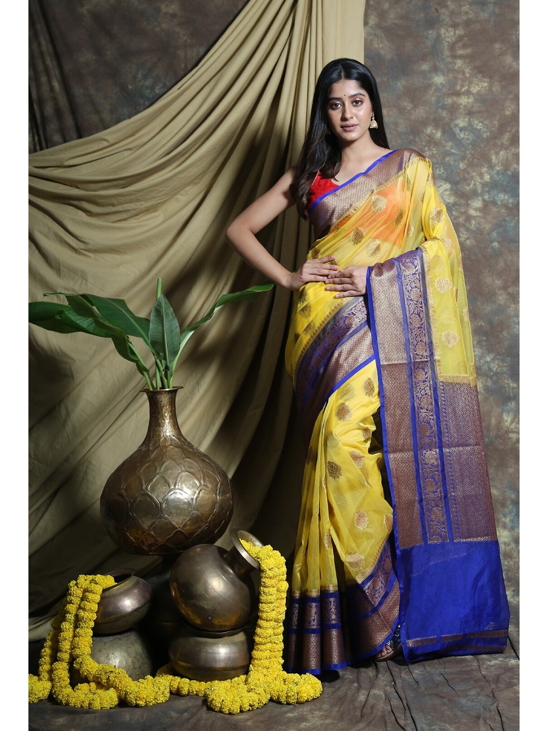 

Charukriti Yellow & Blue Woven Design Zari Organza Saree