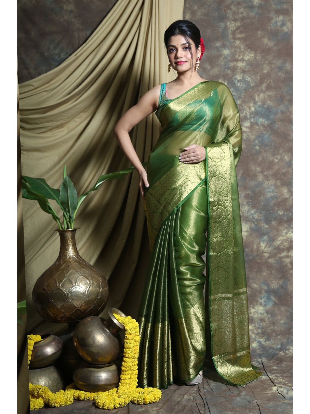 

Charukriti Green & Gold-Toned Woven Design Zari Tissue Saree