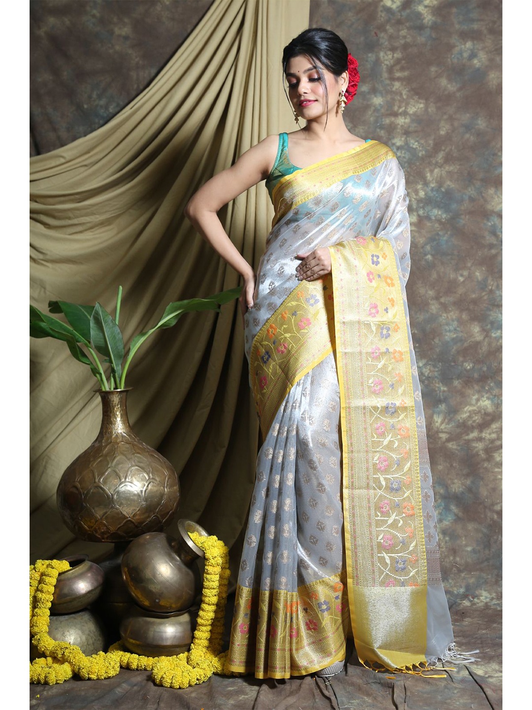 

Charukriti Grey & Yellow Ethnic Motifs Zari Tissue Saree