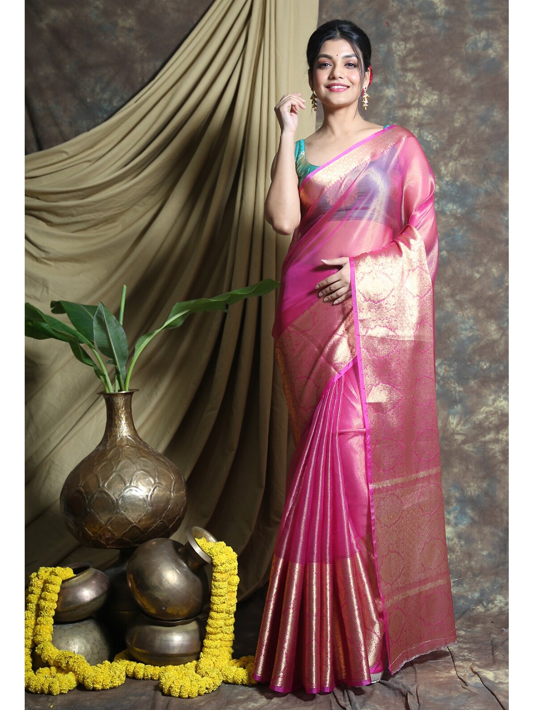 

Charukriti Pink & Gold-Toned Ethnic Motifs Zari Tissue Saree