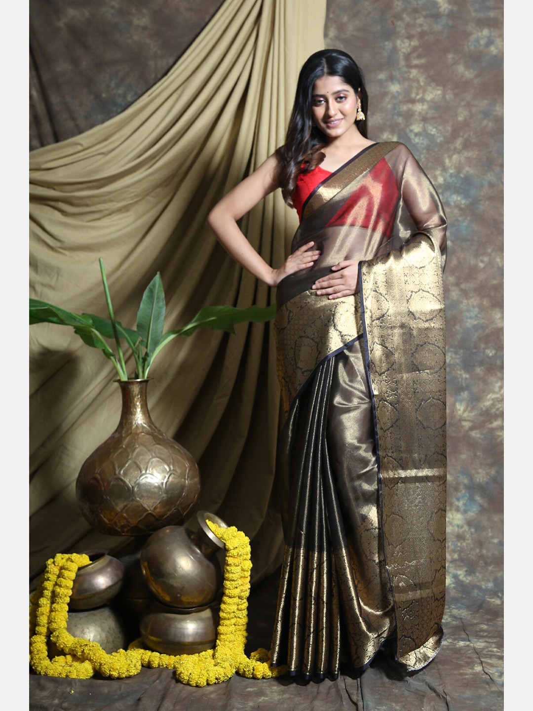 

Charukriti Black & Gold-Toned Woven Design Tissue Handloom Saree