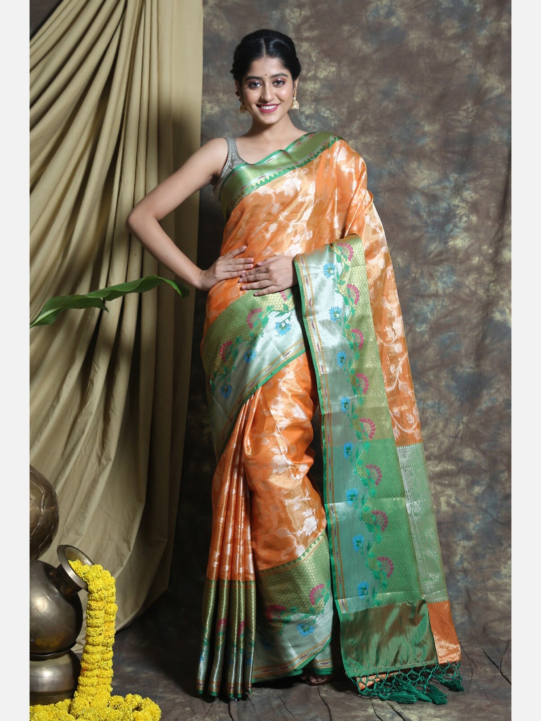 

Charukriti Orange & Green Floral Zari Tissue Saree