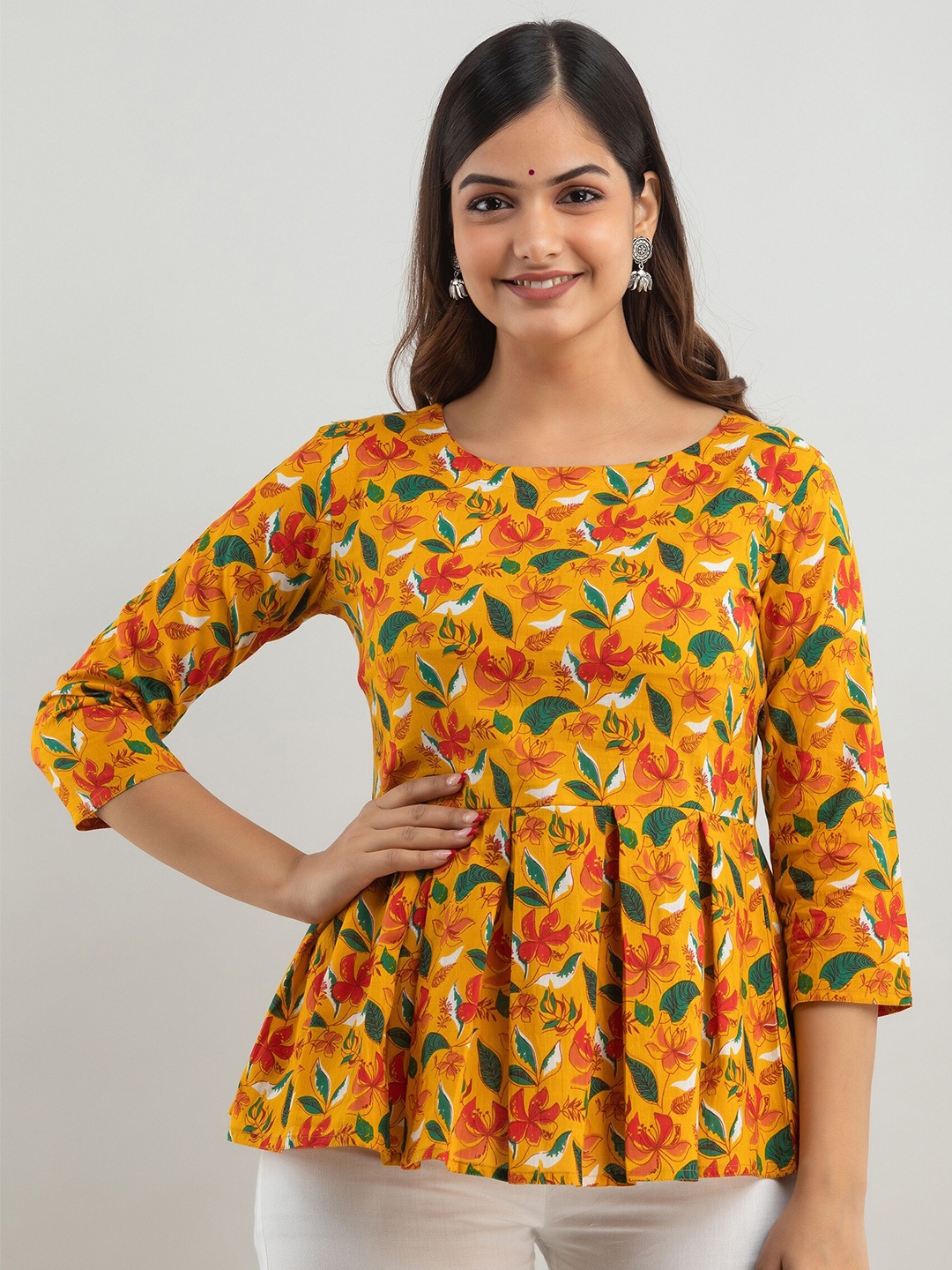 

Women Touch Yellow Ethnic Print Peplum Pure Cotton Top