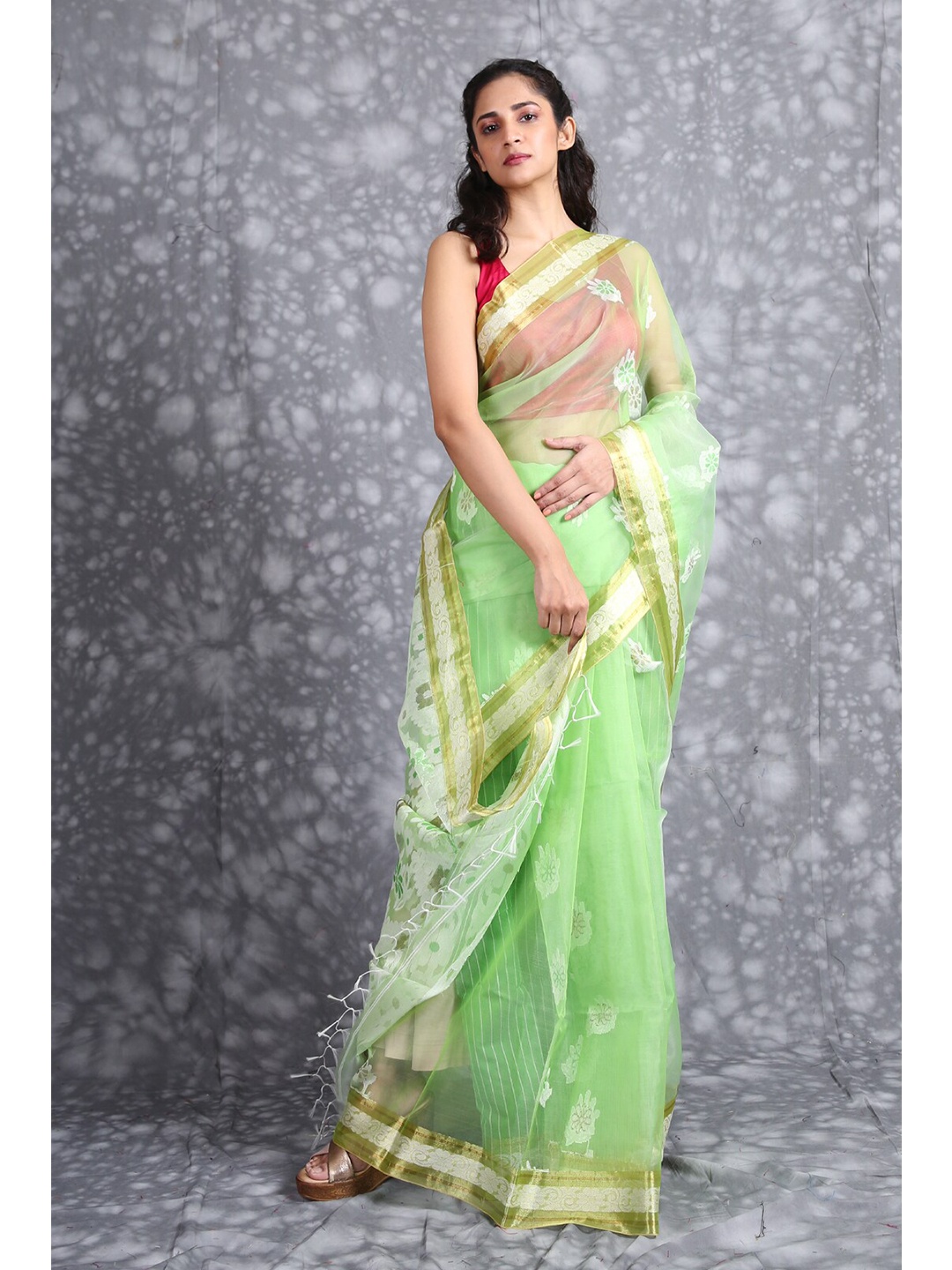 

Charukriti Green & White Ethnic Motifs Zari Pure Silk Saree