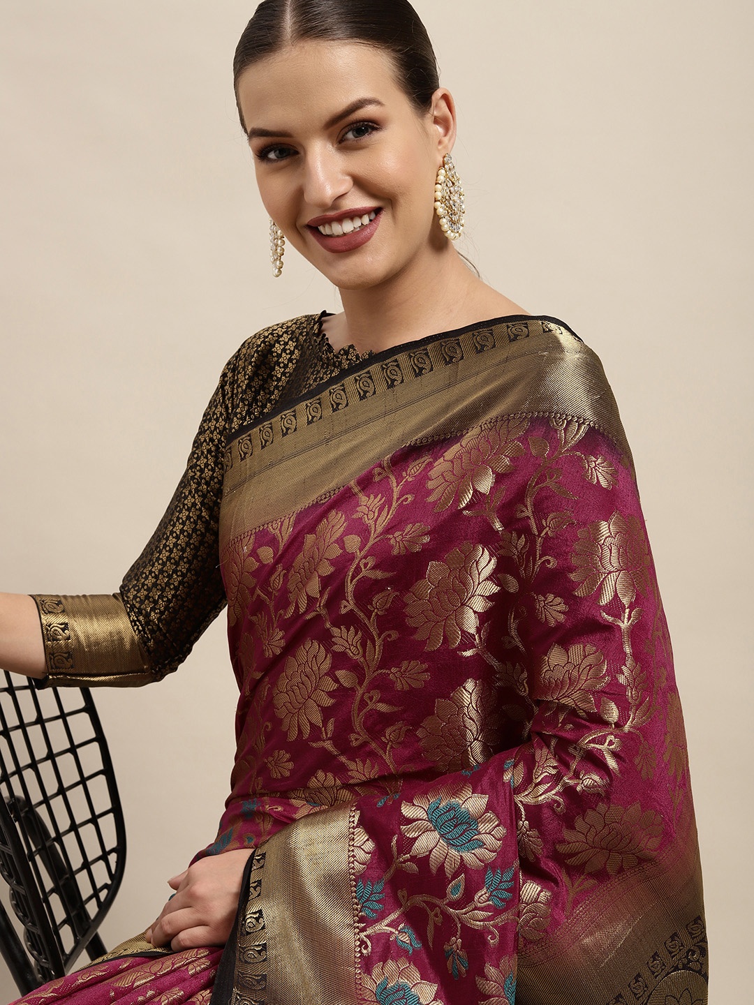 

Mitera Maroon & Golden Ethnic Motifs Silk Blend Saree