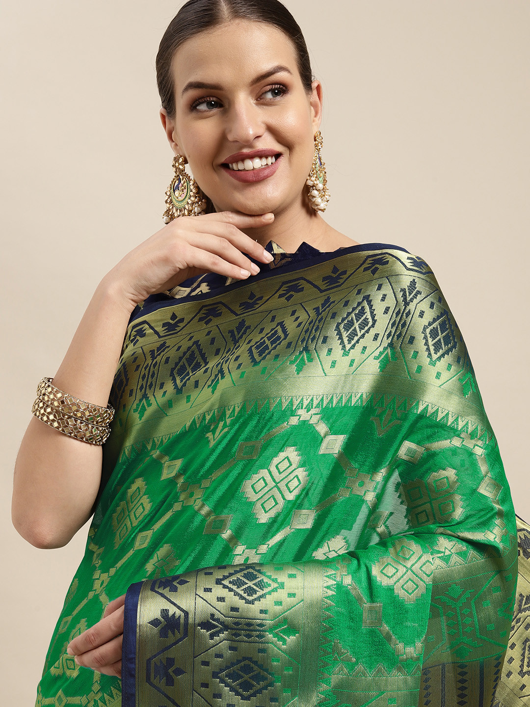 

Mitera Green & Gold Ethnic Motifs Woven Design Silk Blend Saree