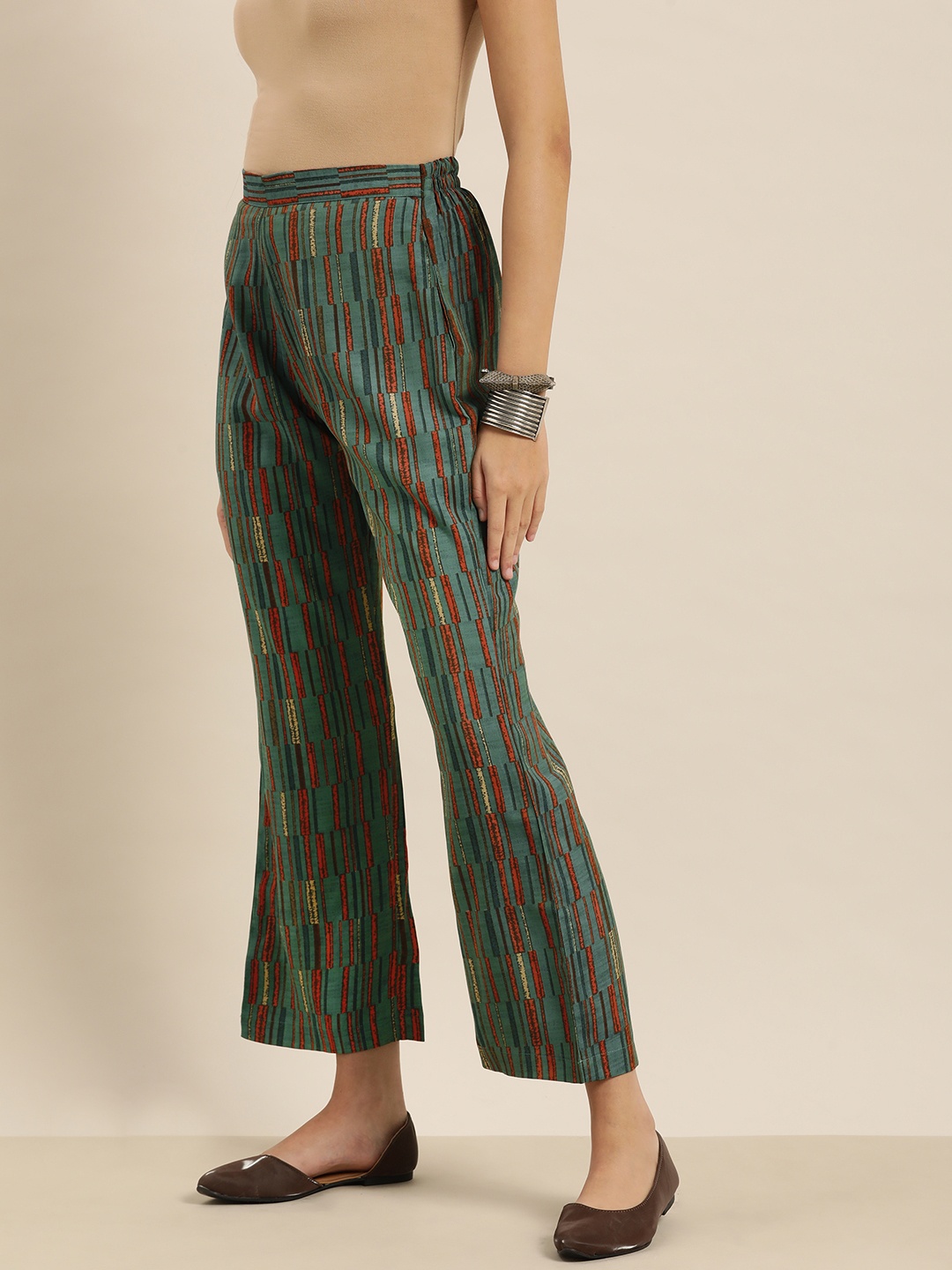 

Sangria Women Green & Rust Orange Striped Printed Palazzos