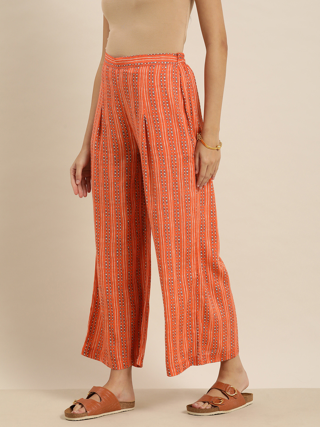 

Sangria Women Orange & Off-White Striped Printed Palazzos