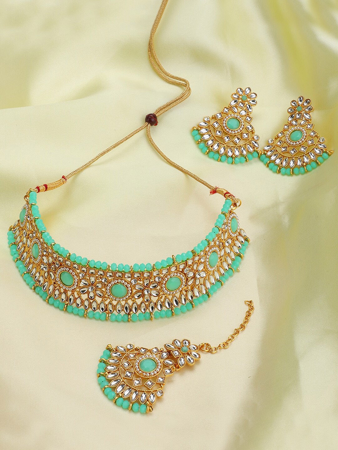 

ANIKAS CREATION Gold-Plated White & Sea Green Stone-Studded & Beaded Jewellery Set