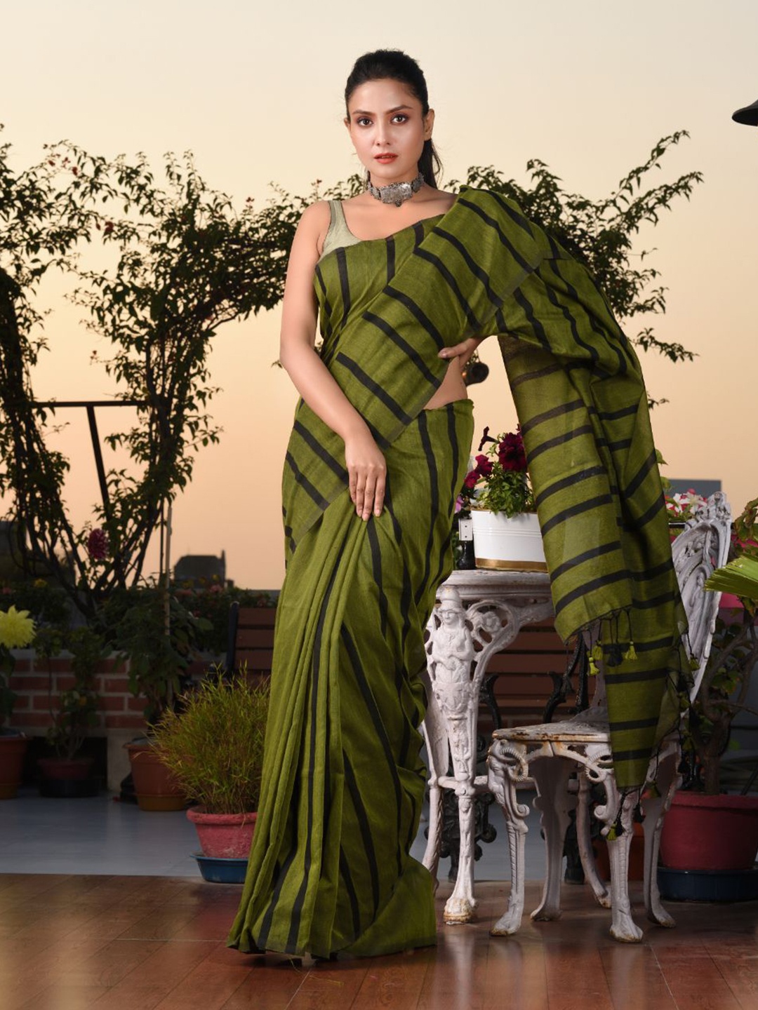 

Charukriti Green & Black Striped Pure Cotton Saree