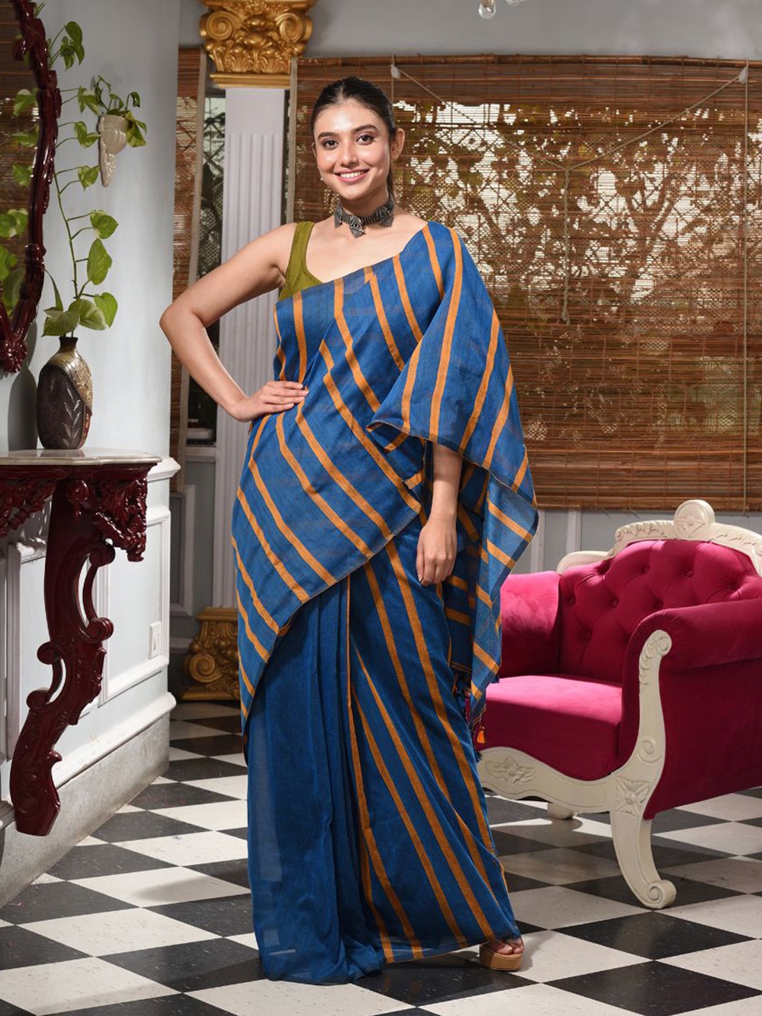 

Charukriti Blue & Mustard Striped Pure Cotton Saree