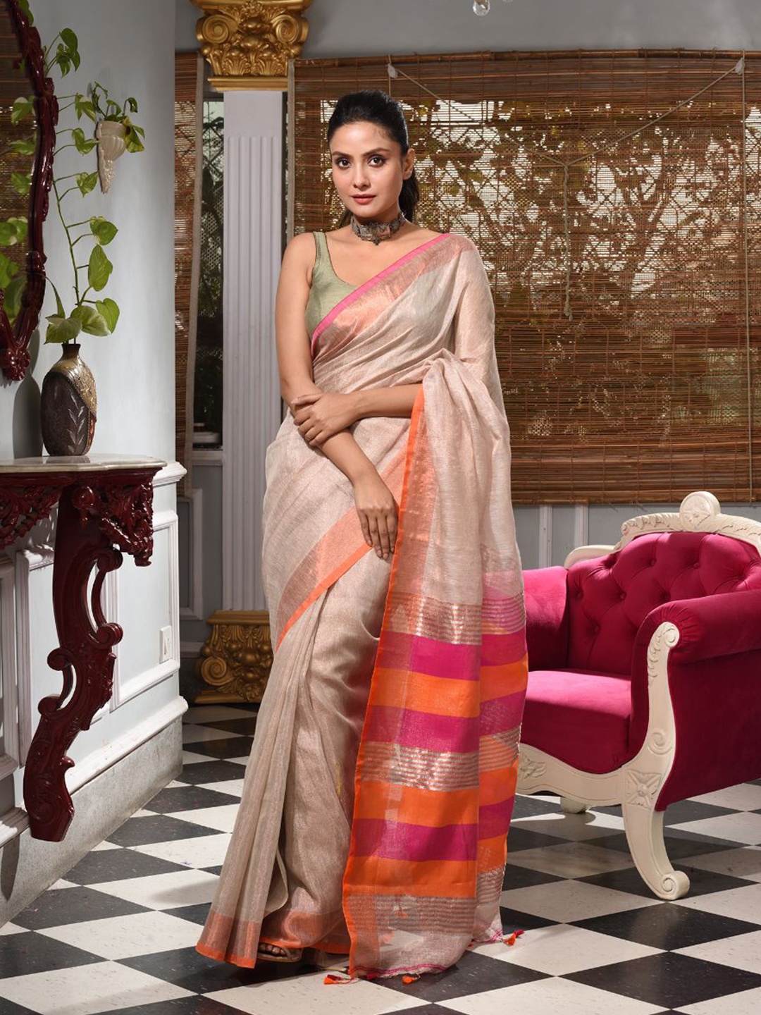 

Charukriti Taupe & Orange Woven Design Zari Tissue Saree