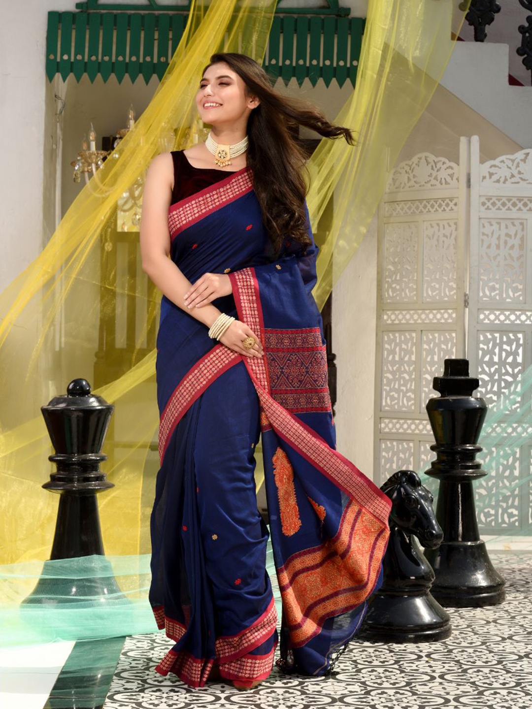 

Charukriti Blue & Red Woven Design Saree