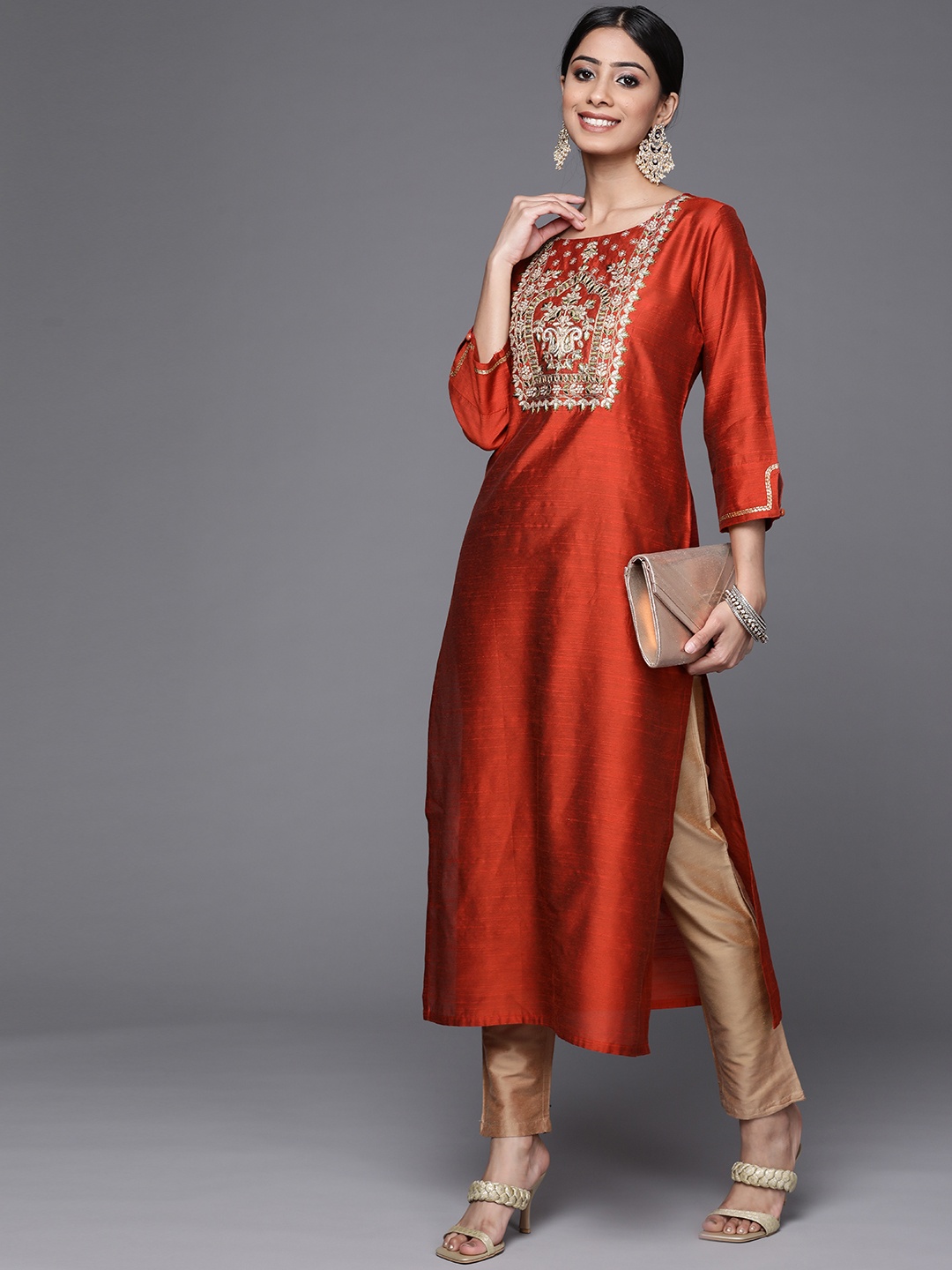 

Varanga Women Rust Orange & Gold-Toned Embroidered Yoke Design Straight Kurta