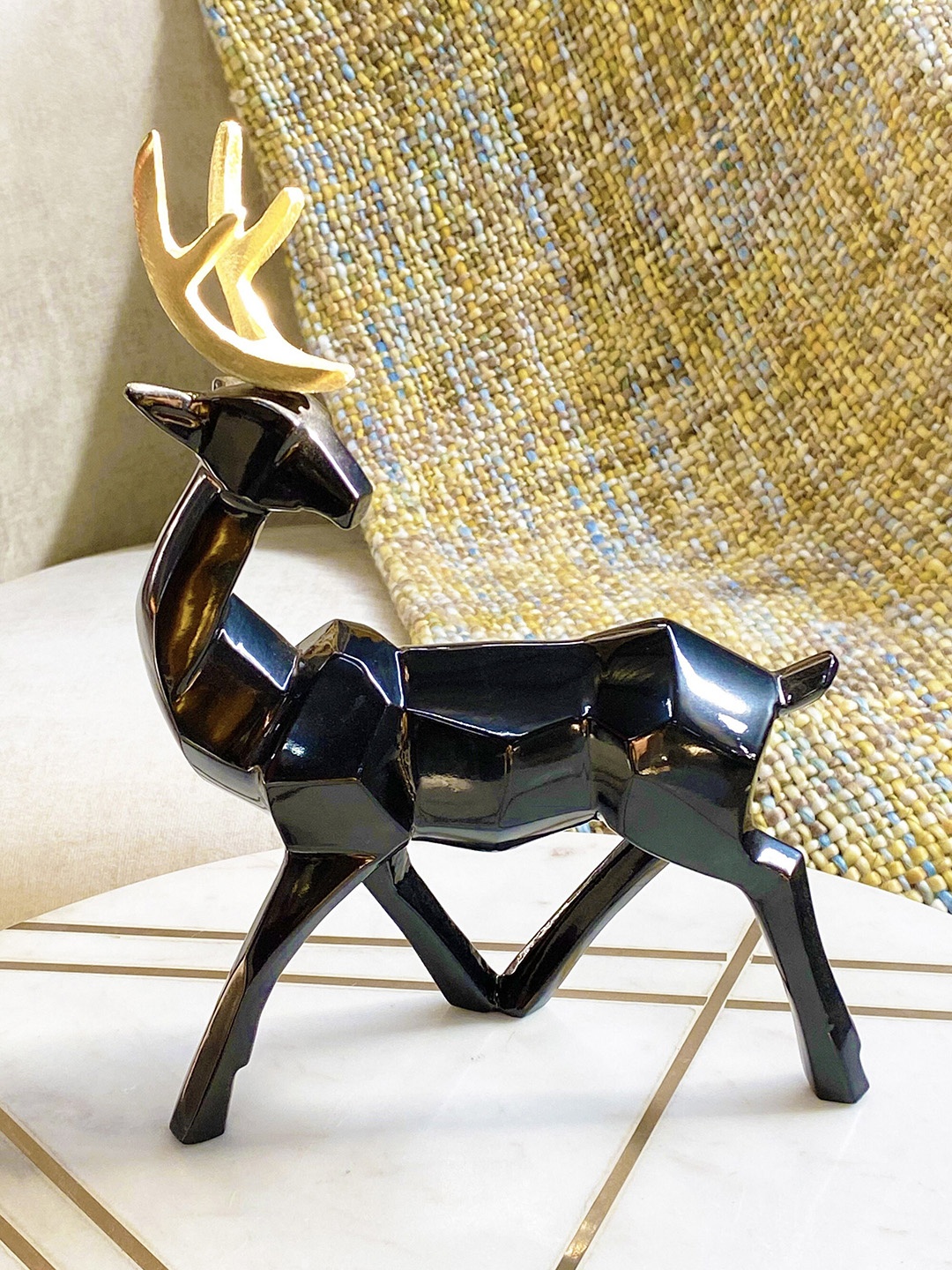 

Folkstorys Black & Gold-Toned Rudolph Deer-Shaped Showpiece