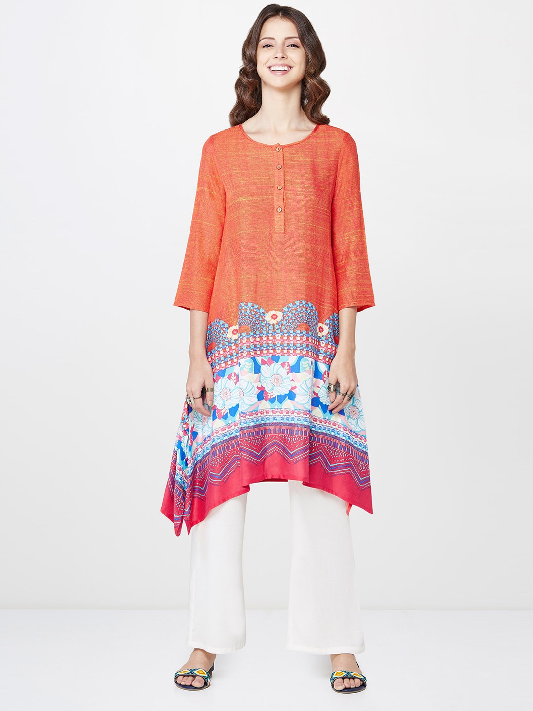 

Global Desi Women Orange Printed Asymmetric A-Line Kurta