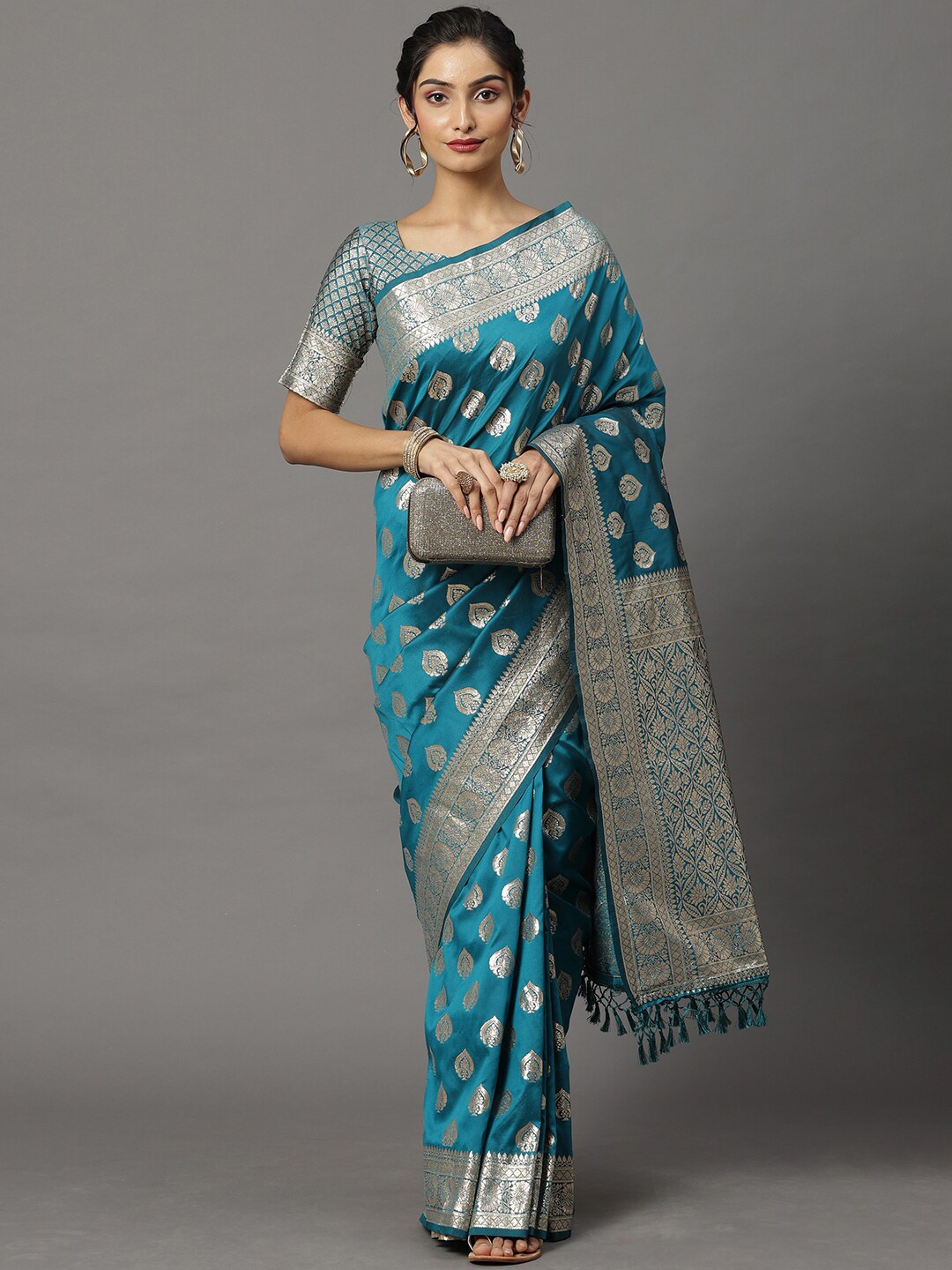 

Mitera Teal & Silver-Toned Ethnic Motifs Silk Blend Banarasi Saree
