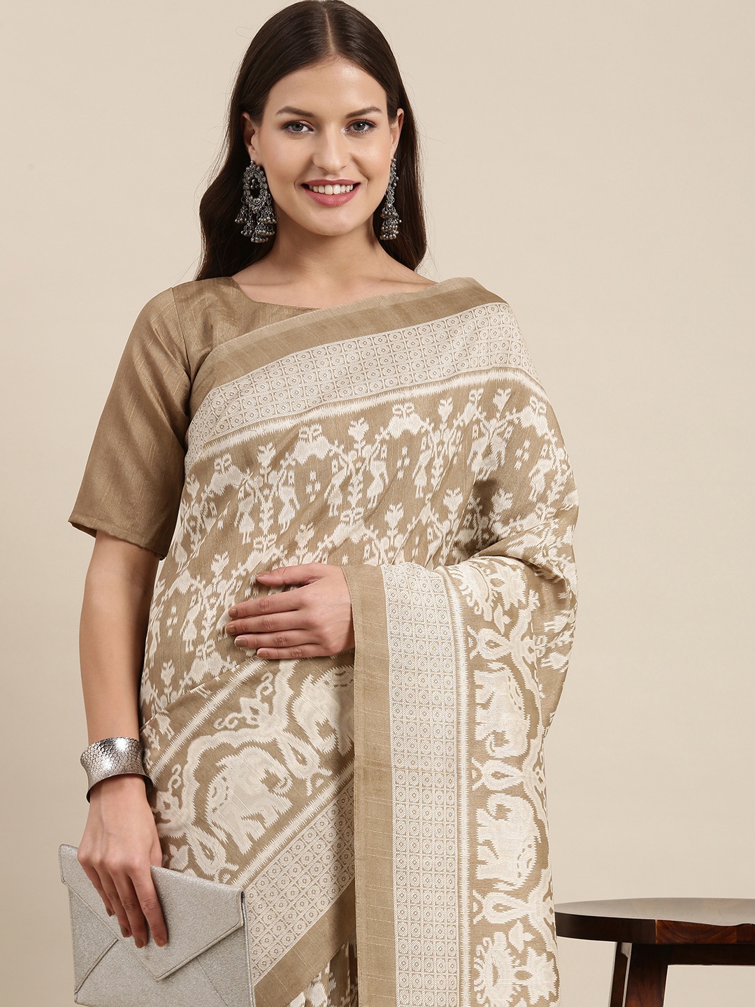 

Mitera Khaki Brown & Beige Abstract Print Bhagalpuri Art Silk Ikat Saree