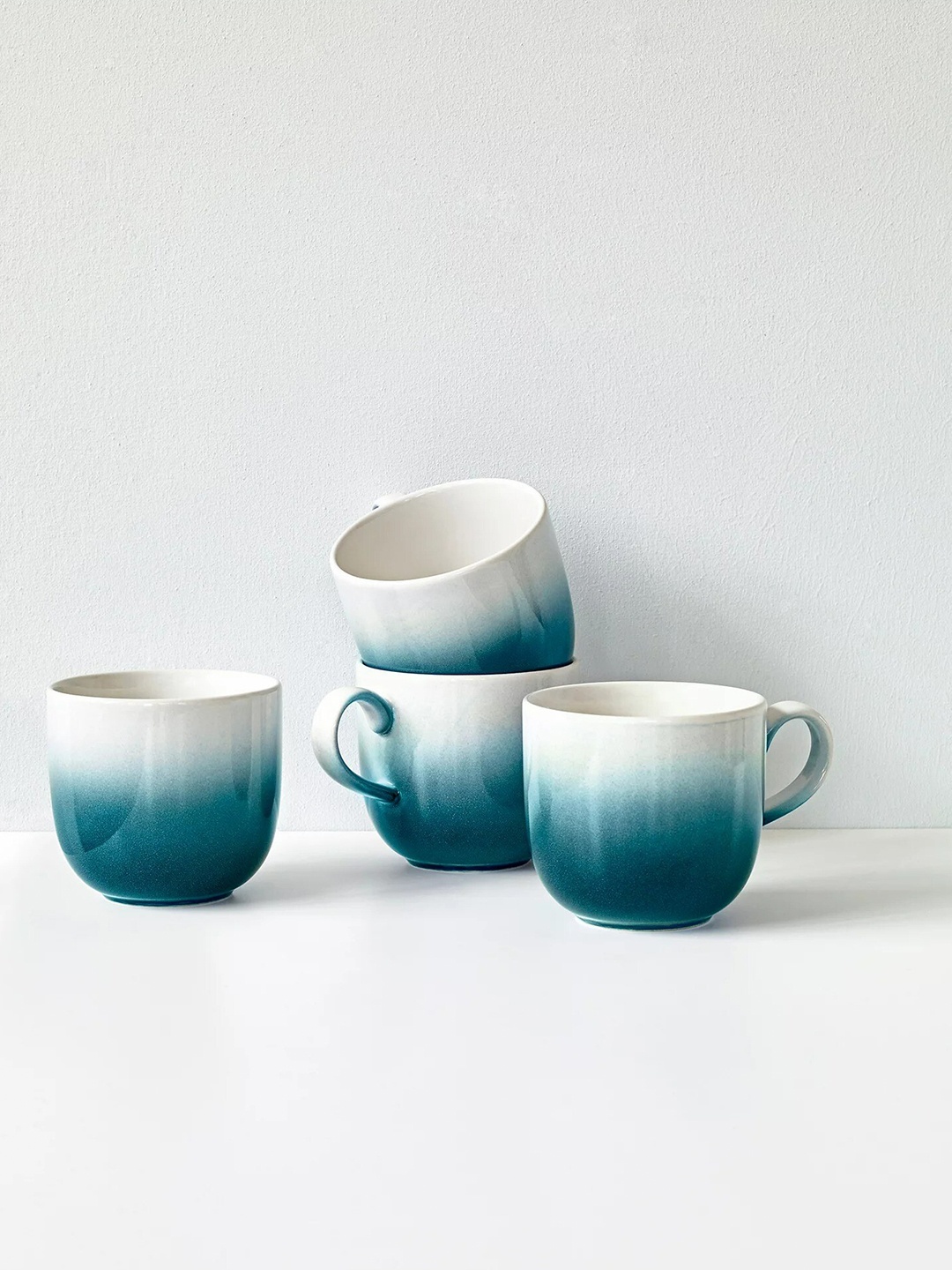 

Marks & Spencer Teal & White Printed Stoneware Glossy Cups Set of Cups and Mugs