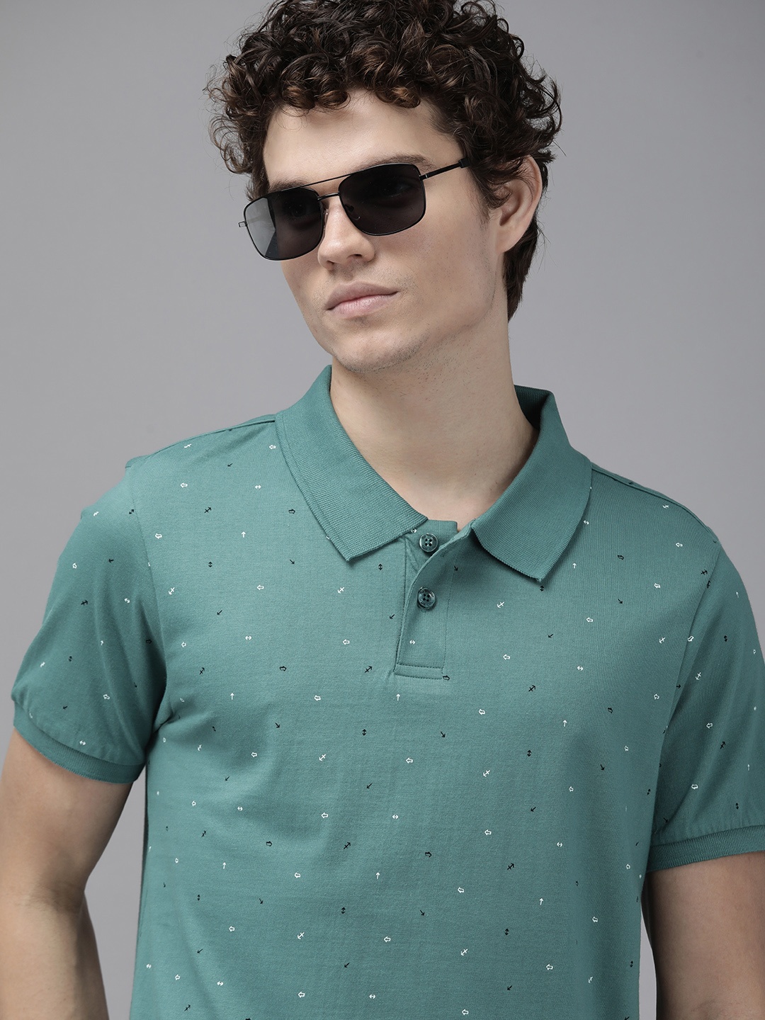 

Roadster Men Teal Green Geometric Printed Polo Collar Pure Cotton T-shirt