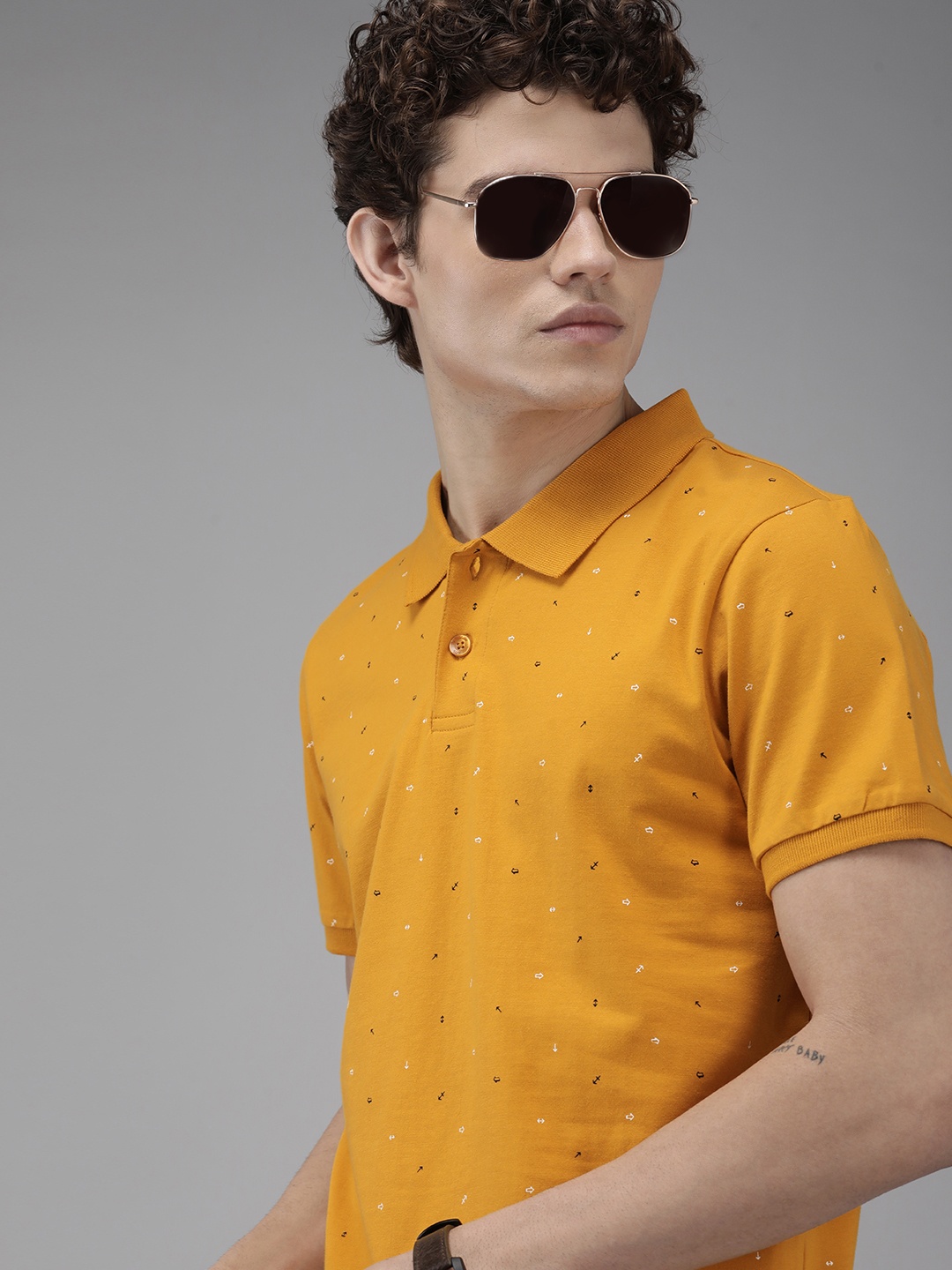 

Roadster Men Mustard Yellow & Black Printed Polo Collar Pure Cotton T-shirt