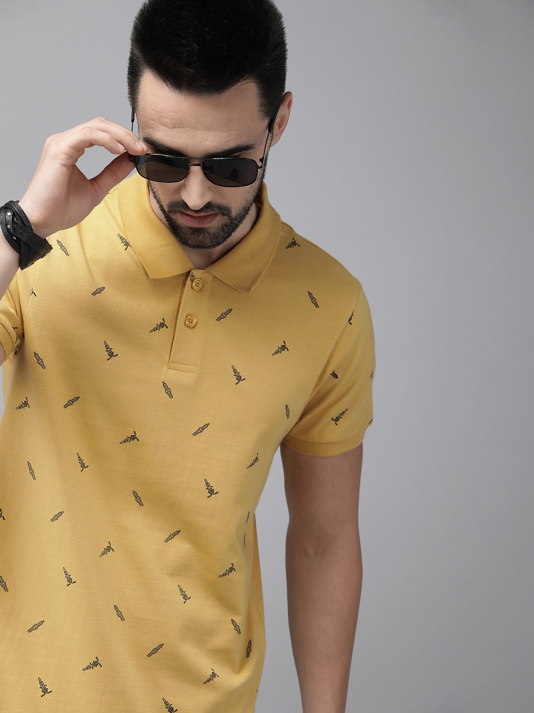 

The Roadster Lifestyle Co Men Yellow & Black Printed Polo Collar Pure Cotton T-shirt